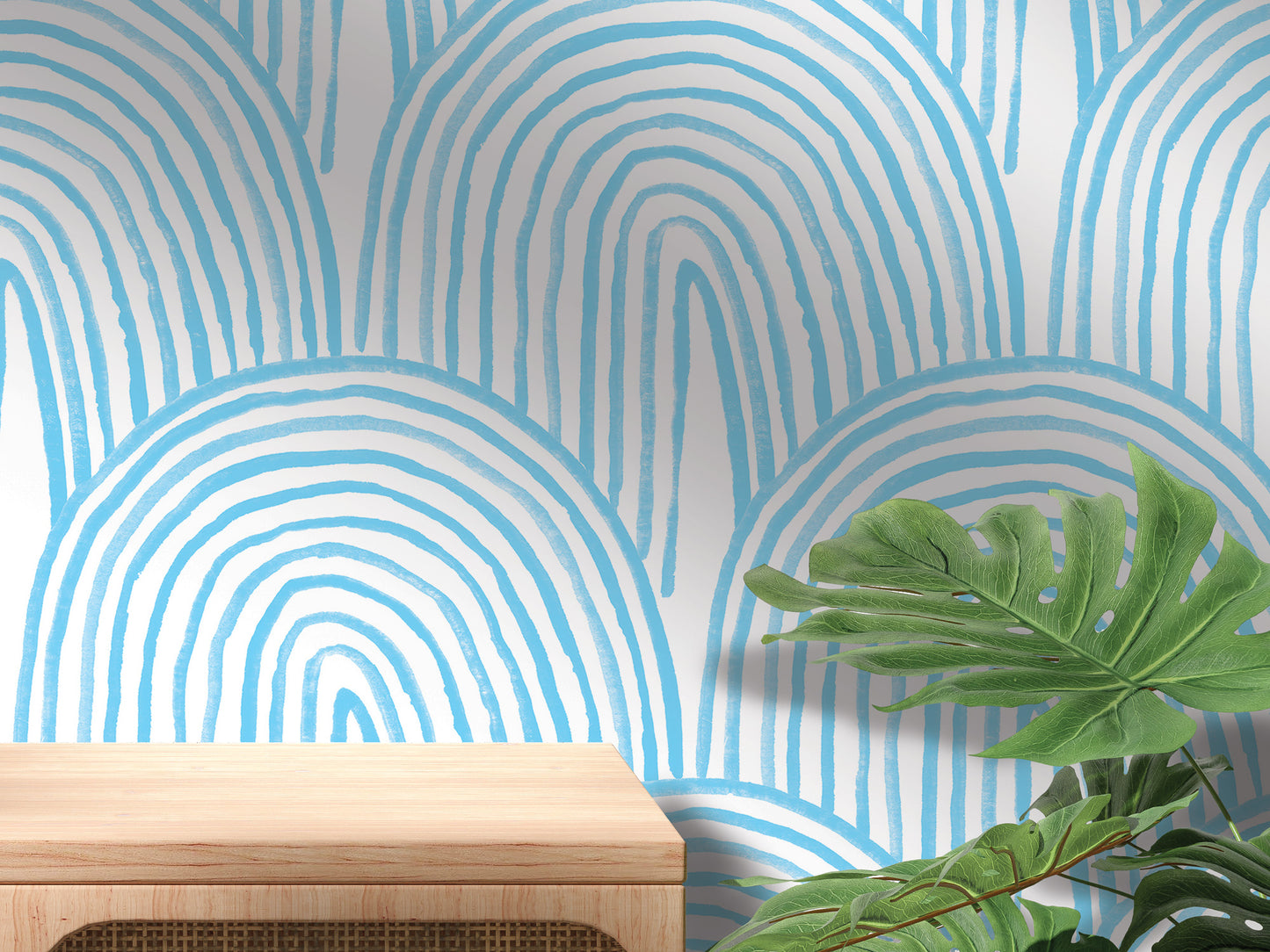 a wooden table with a plant on top, set against a wall with a blue and white striped pattern.