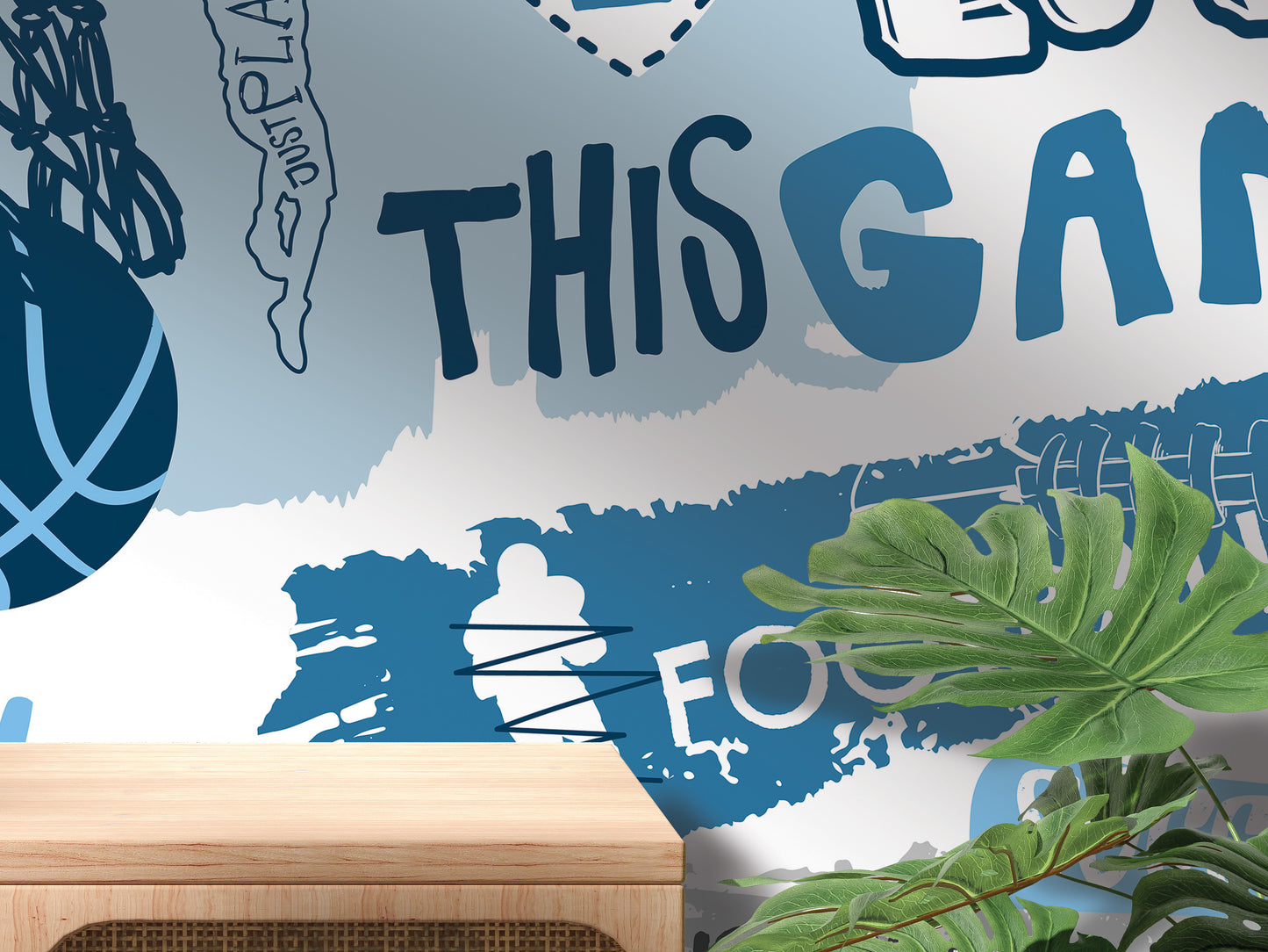The image is a wall mural with various sports-related elements, including a basketball, a person, and a plant. The text "THIS GAY" is prominently displayed in the center of the mural.
