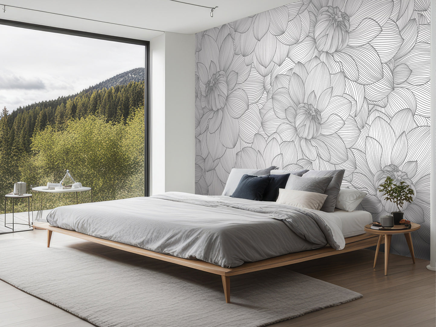 a modern bedroom with a large bed, a nightstand, and a large window overlooking a forested area.