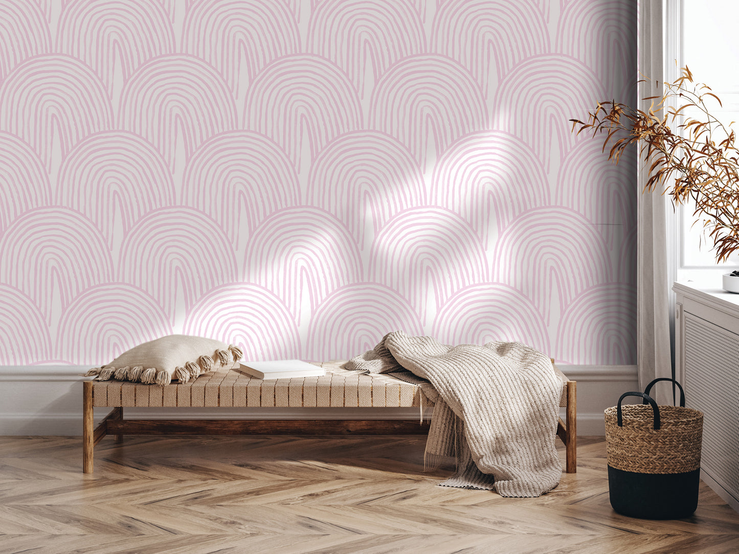 a cozy and inviting living space with a bench, a woven basket, and a plant. The bench is positioned against a wall with a pink and white patterned wallpaper, creating a warm and harmonious atmosphere.