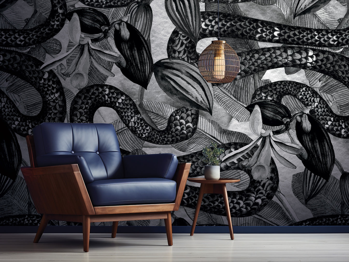 a modern living room with a blue leather armchair and a wooden side table. The wall behind the furniture is covered in a black and white abstract mural, creating a striking visual contrast.