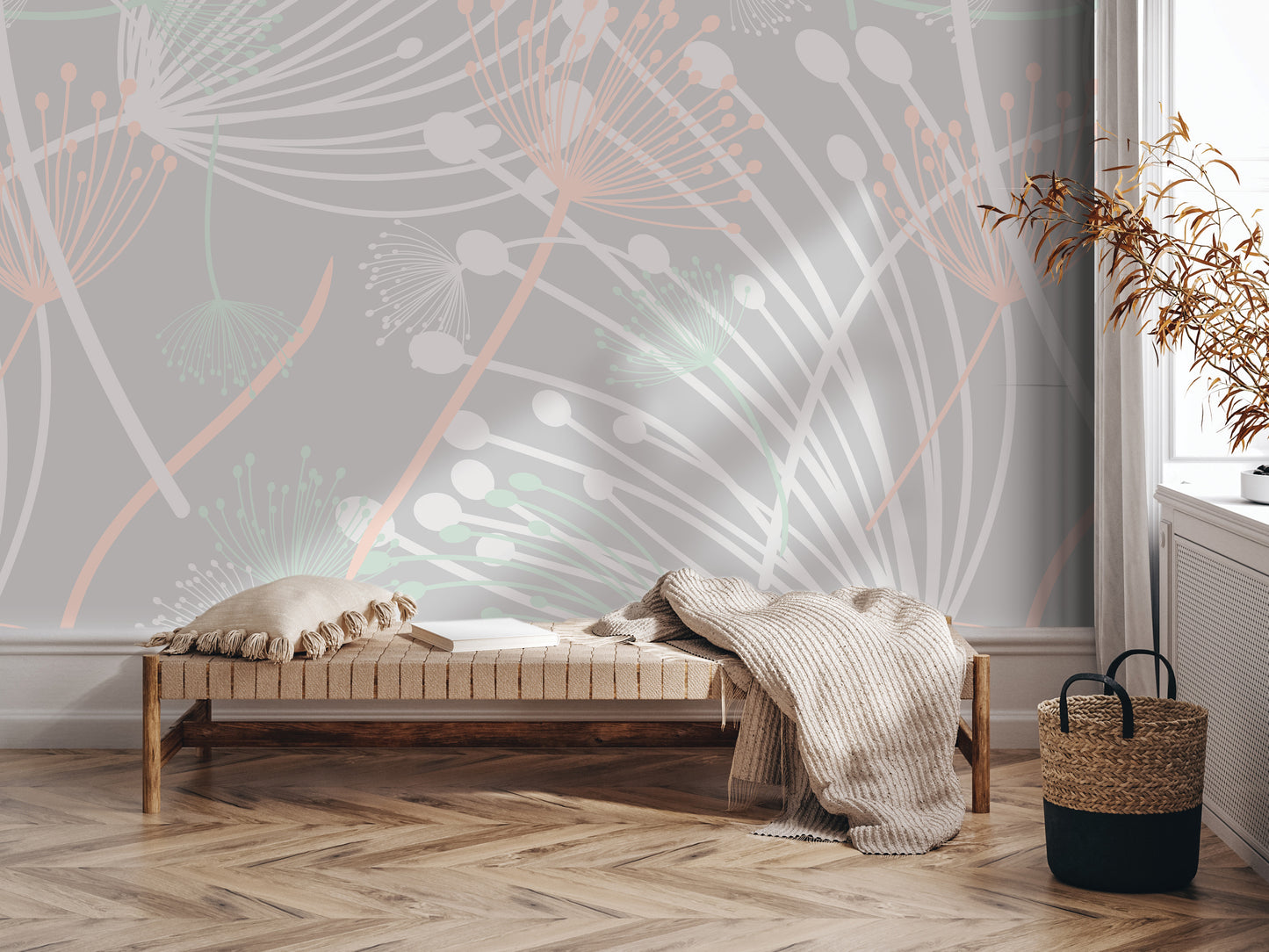 a modern and minimalist living space with a wooden floor, a bench, and a woven basket. The wall behind the bench has a large, abstract floral pattern in shades of pink and white.