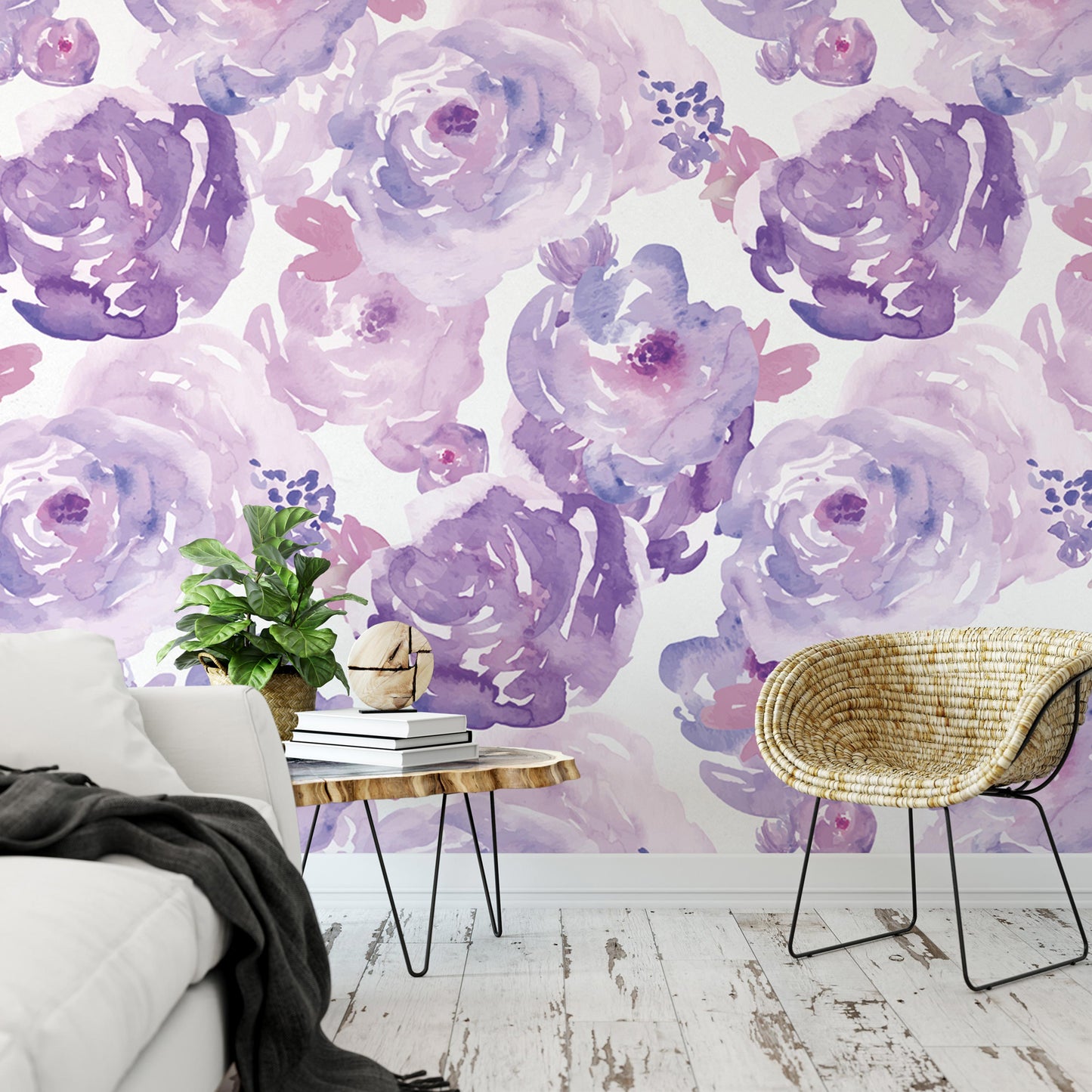 a living room with a white sofa, a wicker chair, and a wooden coffee table. The walls are decorated with a large floral wallpaper in shades of purple and pink.