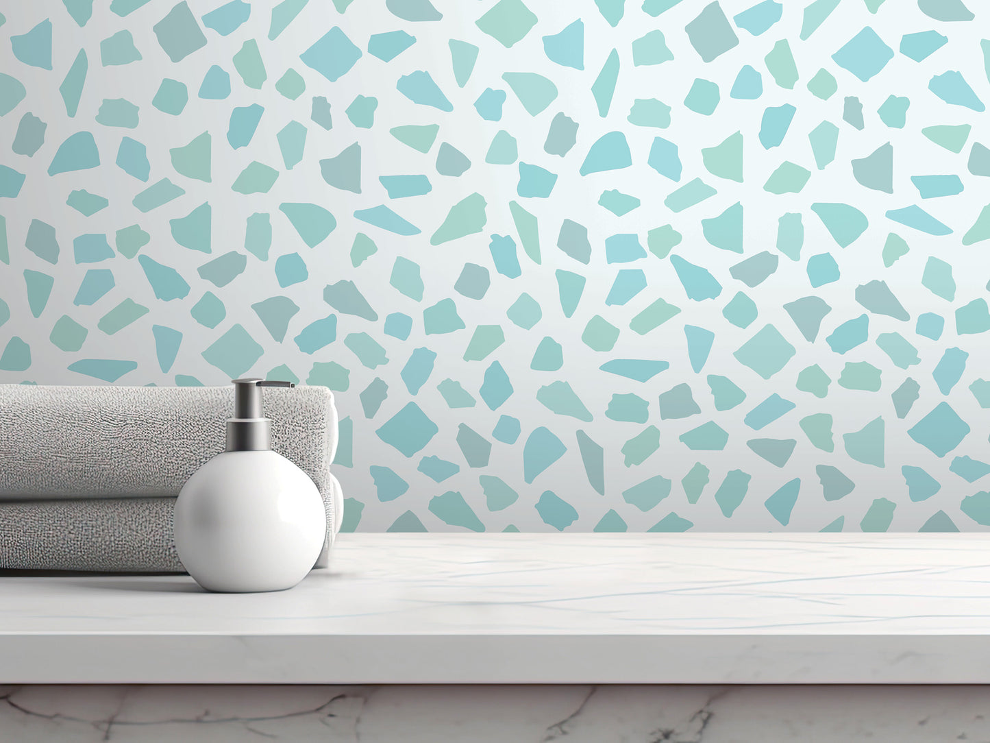 a white countertop with a white soap dispenser and a folded towel, set against a patterned tile wall.