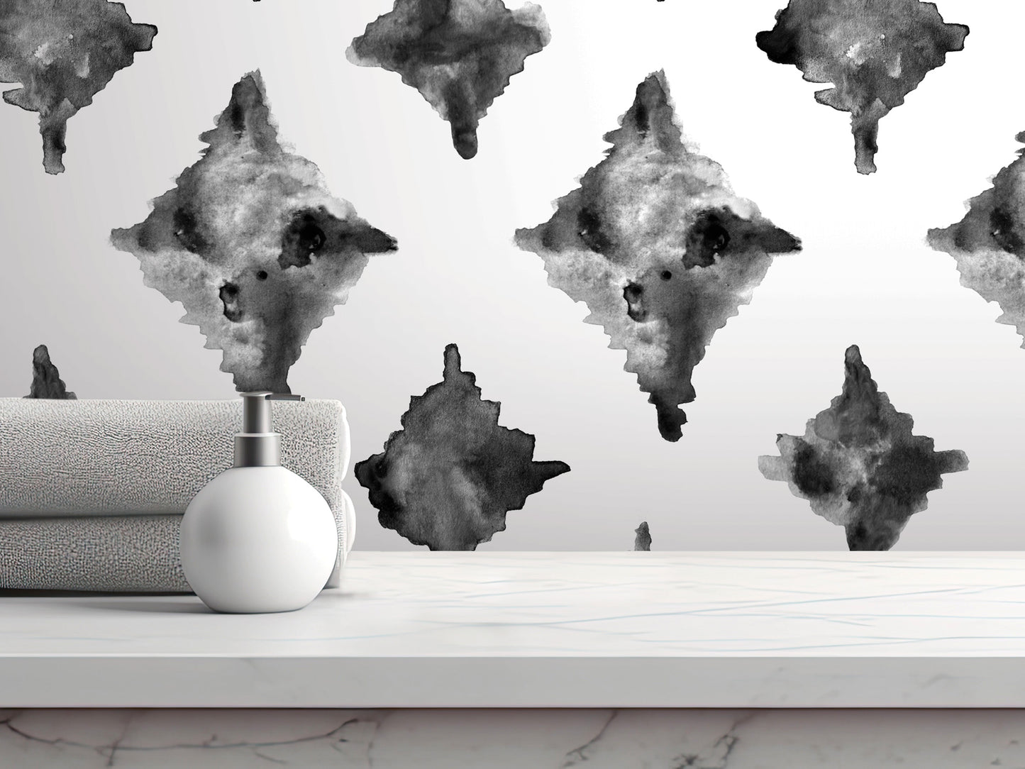 a white marble countertop with a white bottle and a gray towel. The countertop is set against a wall with a repeating pattern of black and white abstract shapes, creating a visually striking and minimalist design.