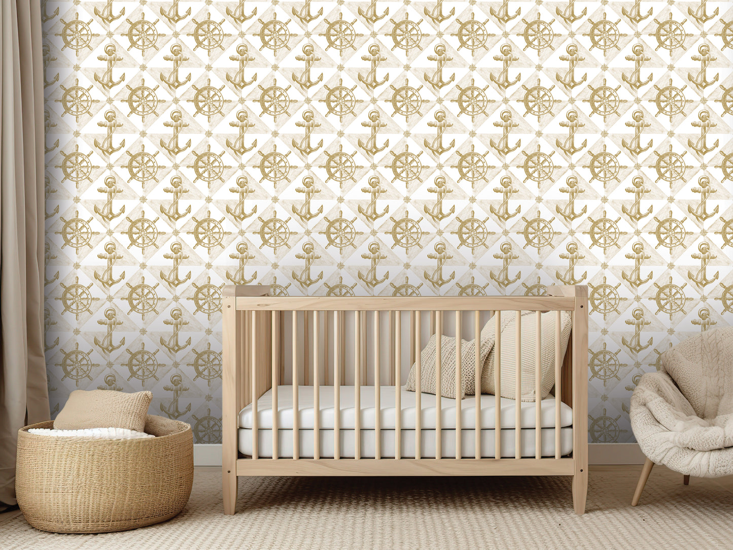 a nursery room with a wooden crib, a woven basket, and a plush chair. The room has a white and gold color scheme, with a wallpapered wall featuring a repeating pattern of gold anchors and sails.
