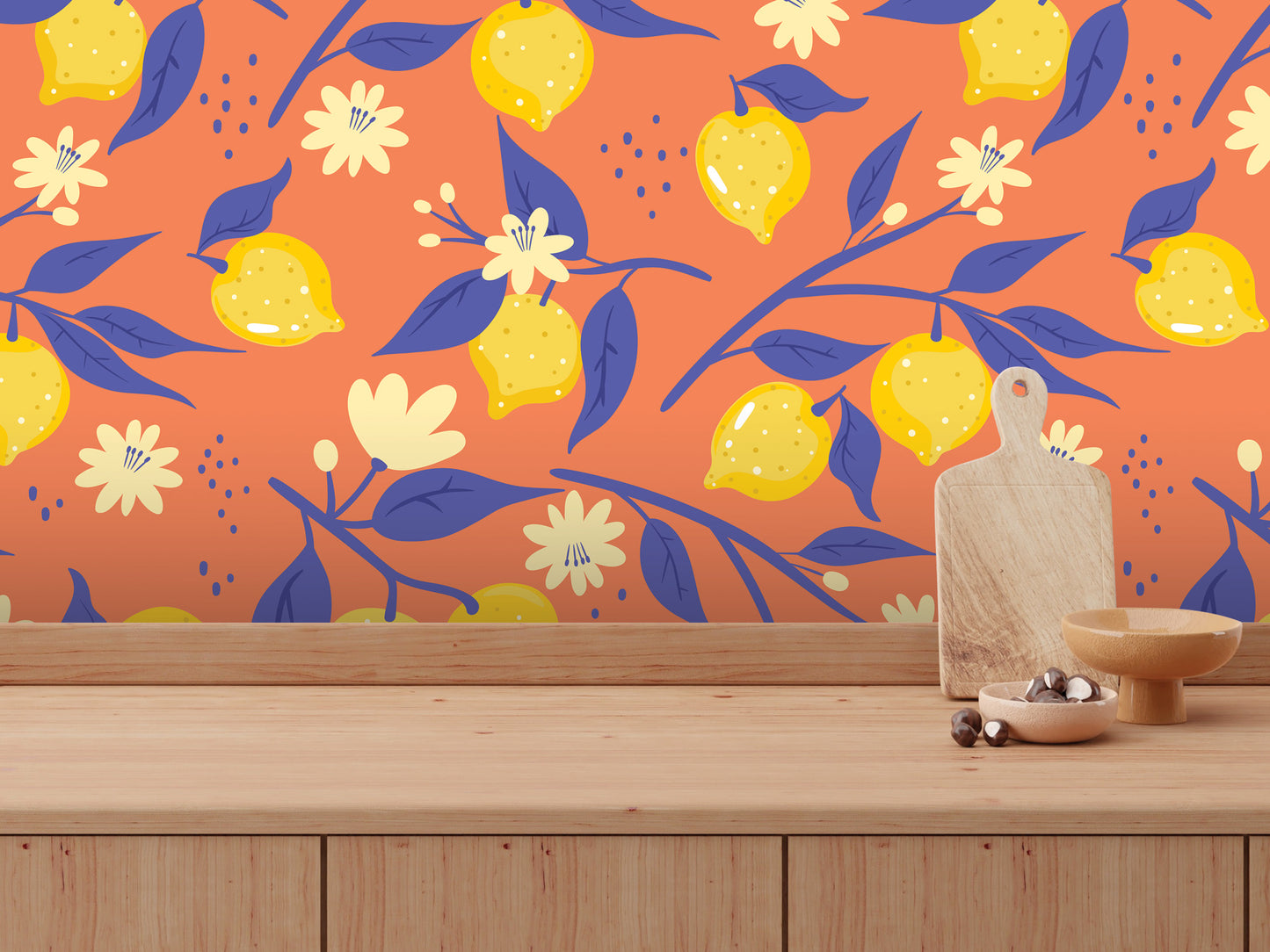 a vibrant and colorful wallpapered wall with a pattern of yellow lemons and blue leaves. In front of the wall, there is a wooden table with a bowl and a cutting board placed on it.