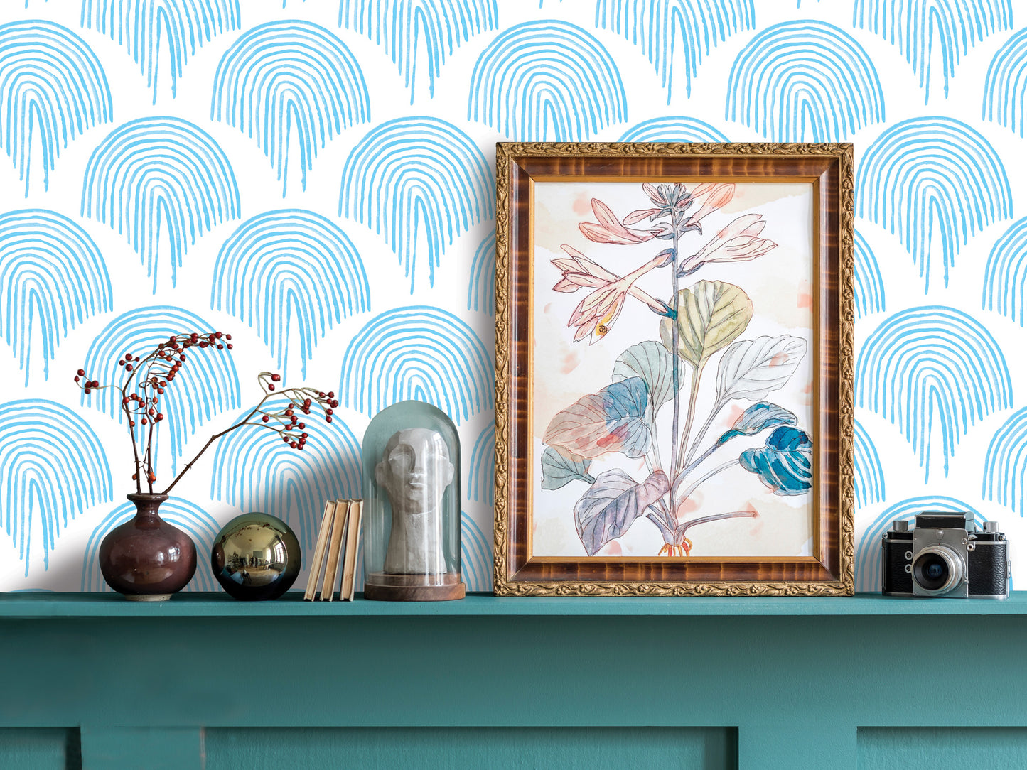 a shelf with various decorative items, including a framed botanical illustration, a vase with flowers, a glass dome, a camera, and a stack of books. The shelf has a blue and white patterned wall behind it, and the overall scene has a harmonious and visually appealing composition.
