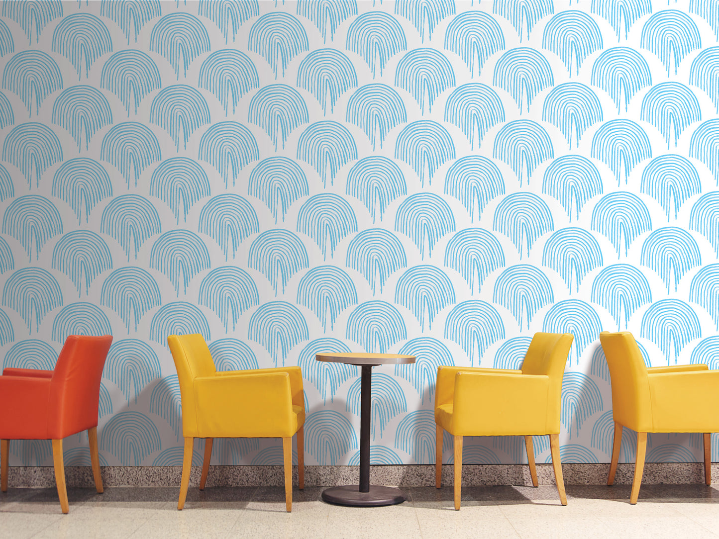 a modern and minimalist design with a patterned blue and white wall behind a row of four yellow chairs. The chairs are arranged in a line, with one chair positioned slightly apart from the others. The overall color scheme and arrangement create a visually appealing and cohesive aesthetic.
