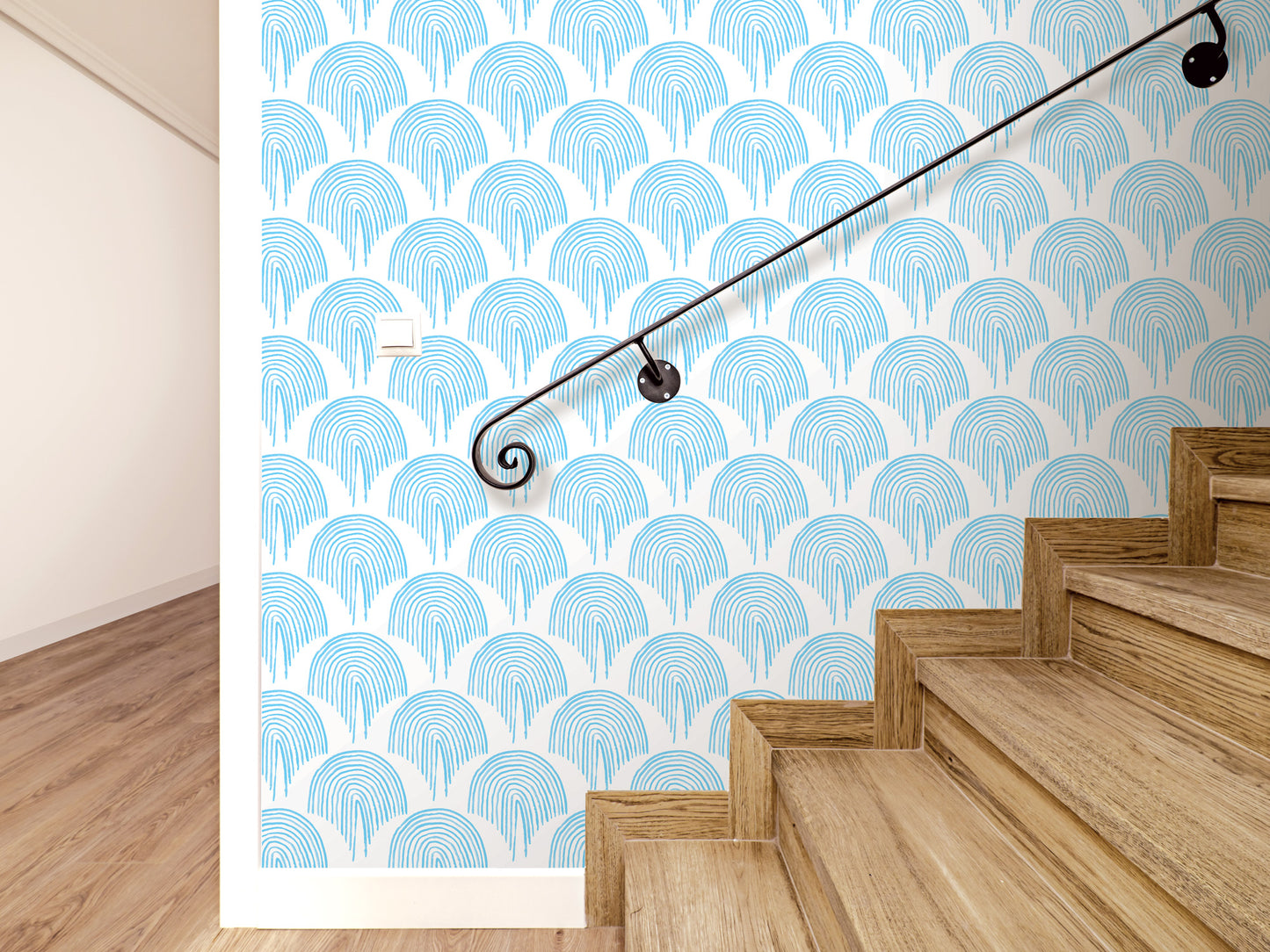 a staircase with a blue and white patterned wall behind it, and a black handrail is visible on the right side of the stairs.
