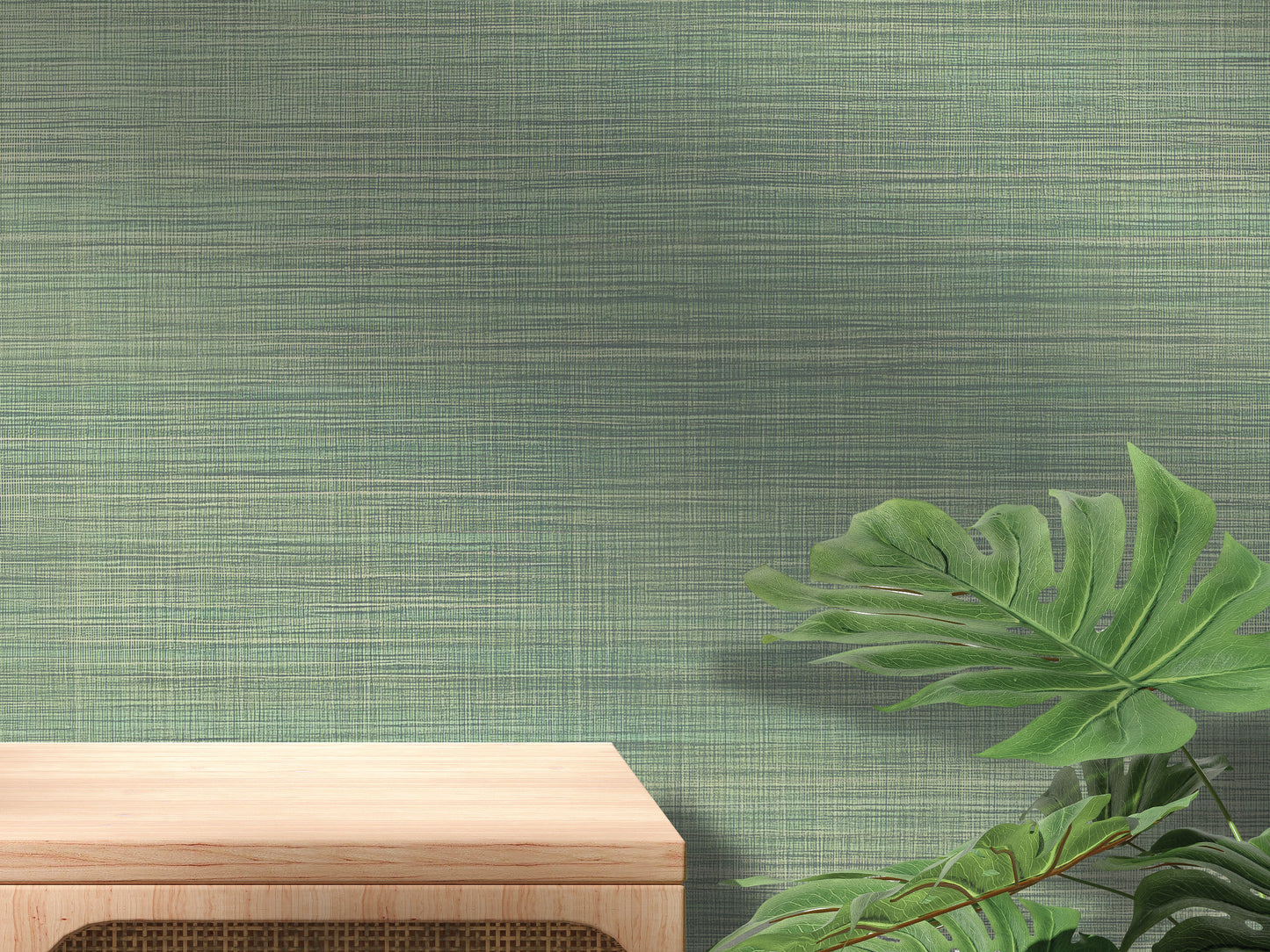 a wooden table with a plant on the right side, set against a textured green wall.