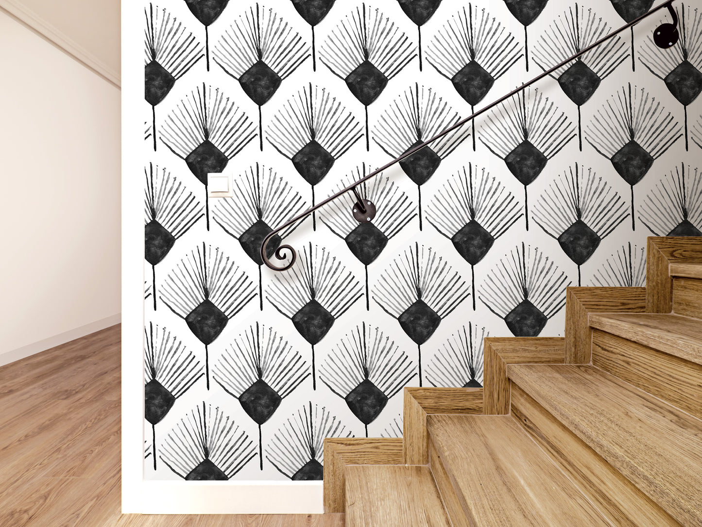 a wall with a repeating black and white pattern of stylized leaves or flowers, creating a visually striking and modern design. The wall is complemented by a wooden staircase with a black metal handrail, adding a touch of elegance and contrast to the overall interior design.