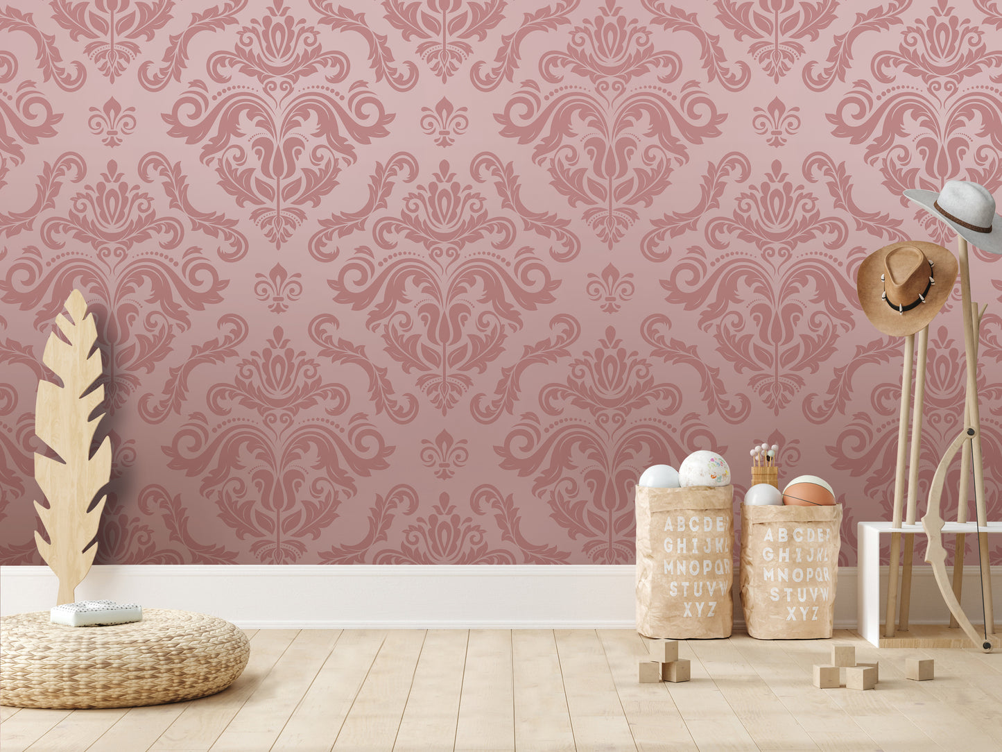 a pink wall with a decorative pattern, a wicker basket, a wooden hat rack, and a wooden stool.