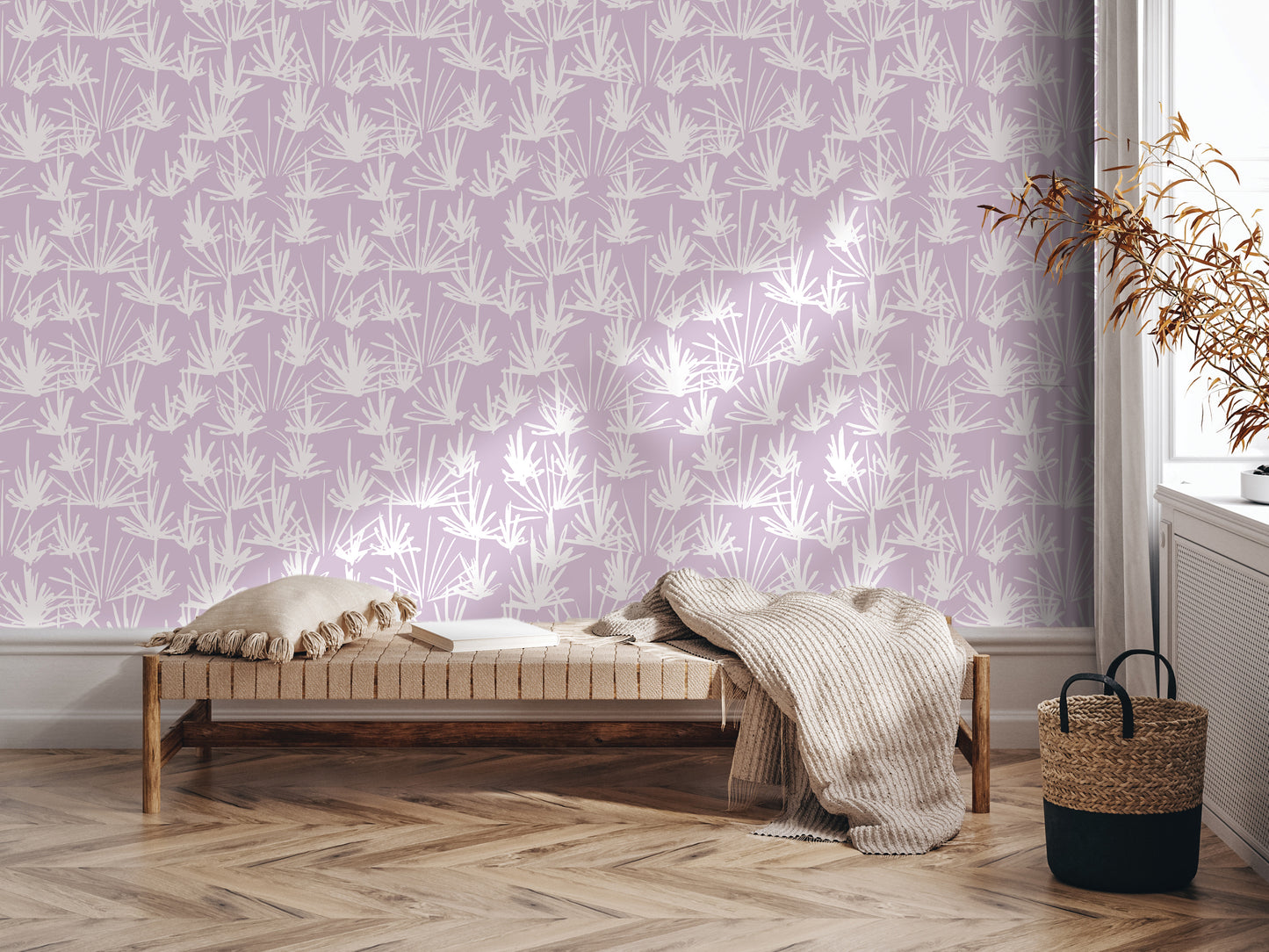 a cozy living space with a purple wall adorned with a repeating pattern of white palm leaves. In the foreground, there is a wooden bench with a beige blanket draped over it, and a woven basket next to it. The room has a hardwood floor, and a window can be seen on the right side of the image.