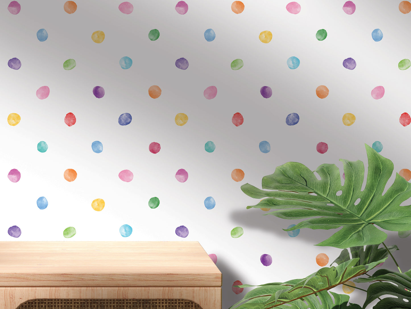 a wall with a polka dot pattern and a wooden table in the foreground.