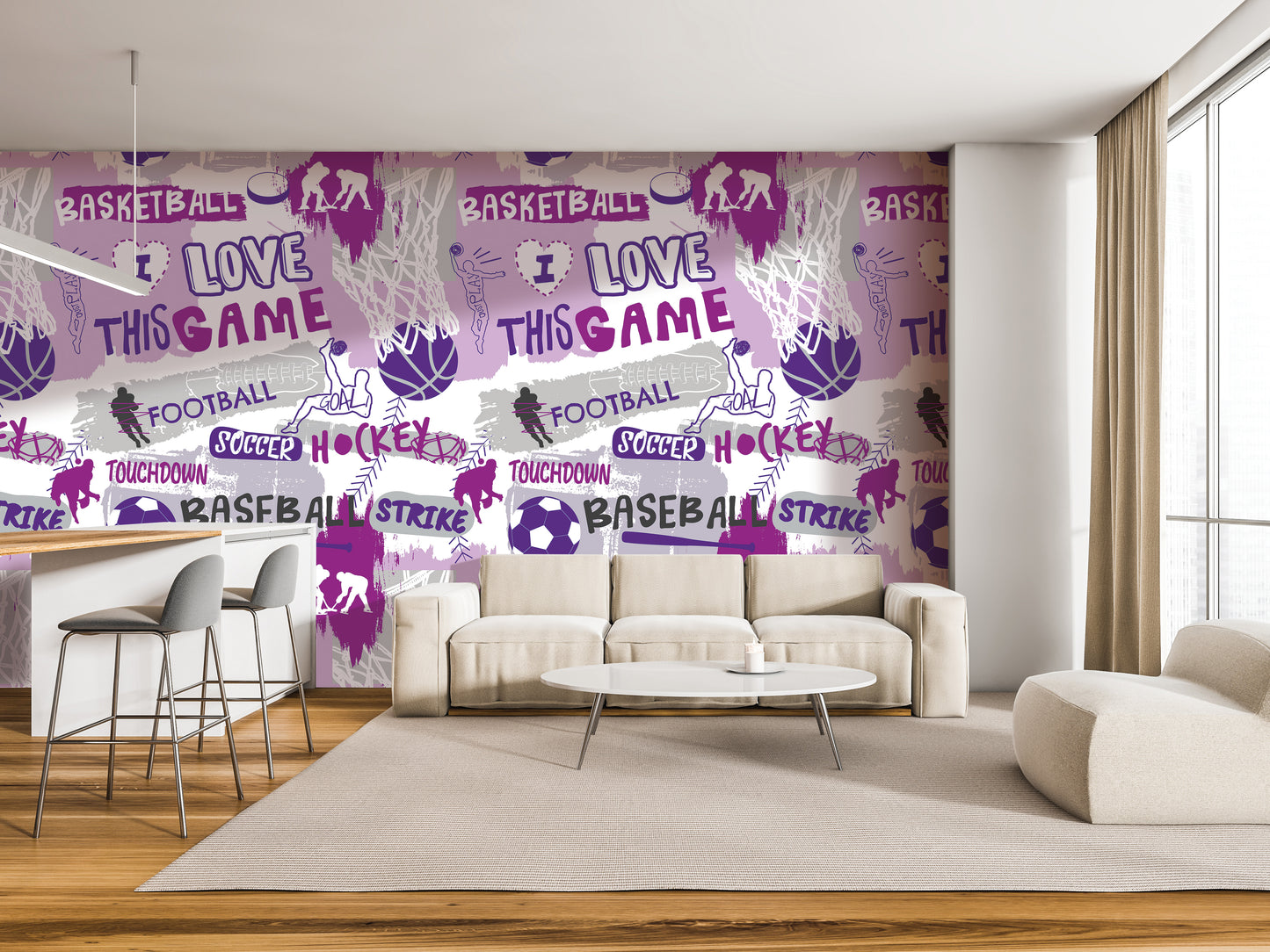 a modern living room with a large wall mural that showcases various sports-related phrases and images, including basketball, football, hockey, and baseball. The room is furnished with a white sofa, a coffee table, and a barstool, creating a comfortable and stylish atmosphere.