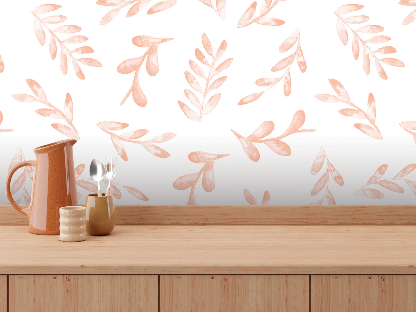 a wooden table with various kitchen utensils, including a pitcher, a small cup, and a spoon, arranged on it. The background has a repeating pattern of orange leaves on a white wall.