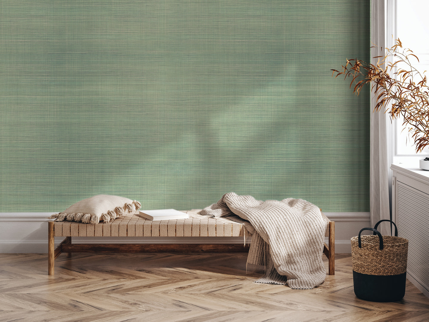 a cozy corner with a wooden bench, a woven basket, and a plant, all set against a textured green wall.