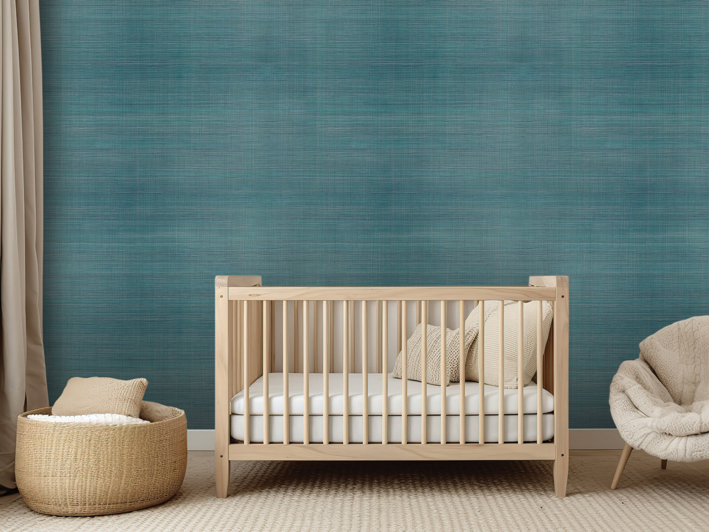 a modern nursery with a wooden crib, a woven basket, and a plush chair, all set against a textured blue wall.