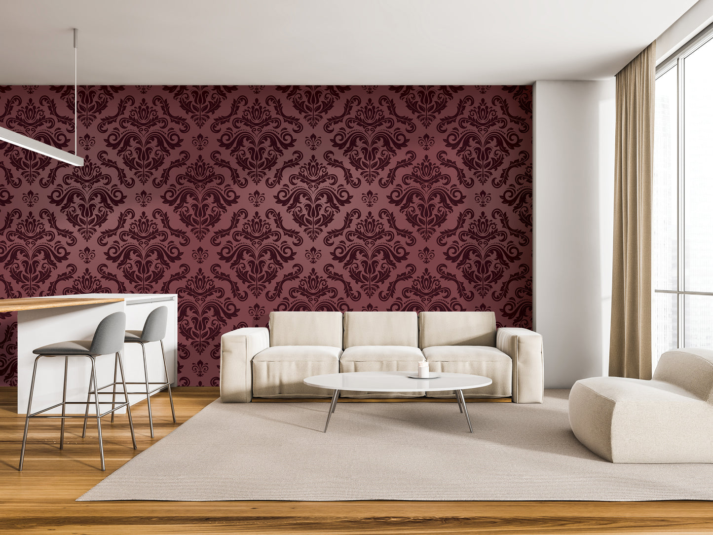 a modern living room with a large, burgundy-colored damask pattern on the wall behind a white sofa and a white coffee table. The room also includes a bar area with stools and a white countertop.