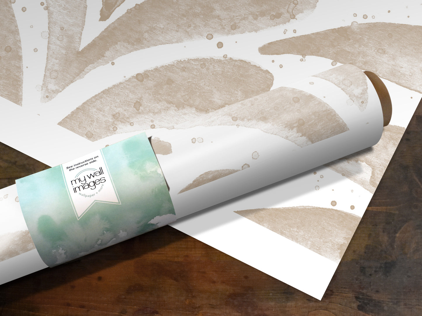 A roll of paper with a watercolor-style design printed on it, placed on a wooden surface.