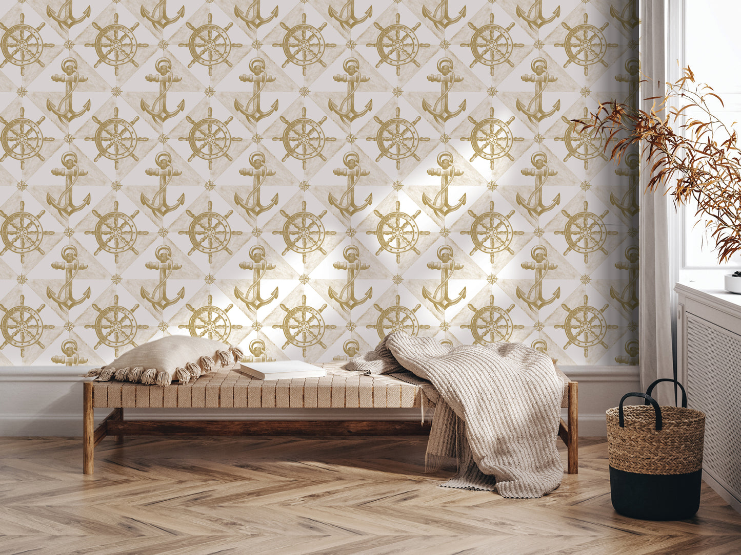 a cozy and inviting living space with a wooden floor and a bench against a wall adorned with a repeating pattern of gold anchors and ship wheels. The wall also displays a nautical-themed wallpaper, adding to the nautical ambiance of the room. A woven basket is placed next to the bench, and a potted plant is situated nearby, contributing to the overall aesthetic and comfort of the space.