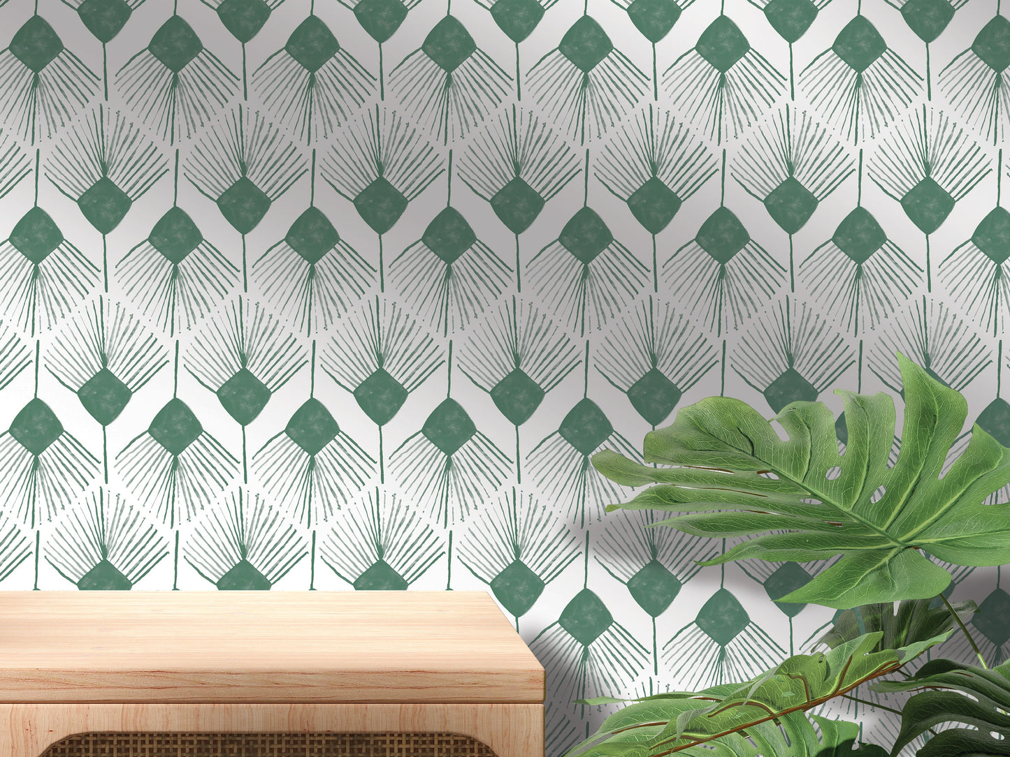 a wall with a repeating pattern of green and white diamond shapes, creating a visually striking and modern design. In the foreground, there is a wooden table and a large green leafy plant, adding a touch of nature and warmth to the scene.