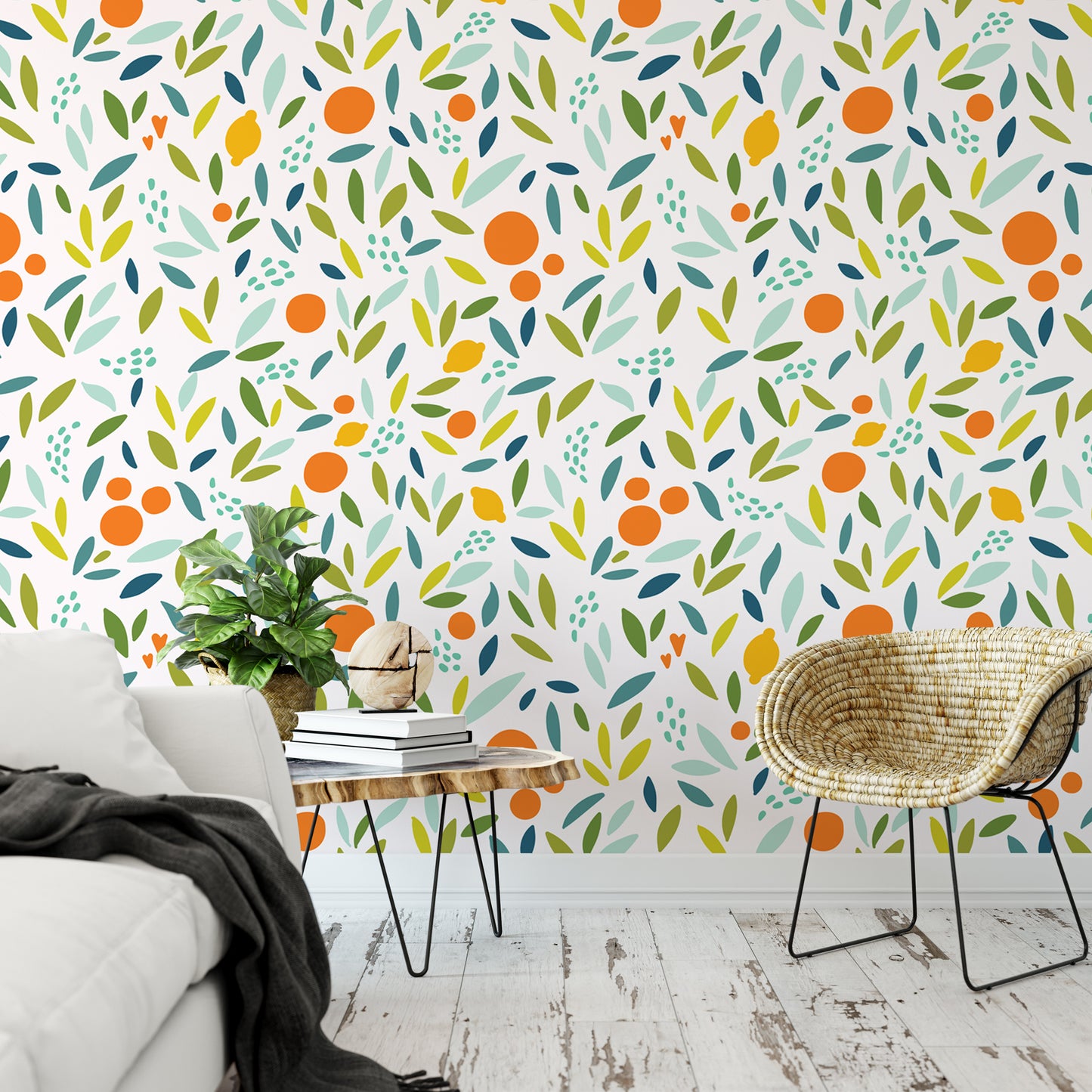 a living room with a white sofa, a wicker chair, and a wooden coffee table. The walls are decorated with a vibrant, abstract pattern of orange and green leaves and circles, creating a lively and energetic atmosphere.