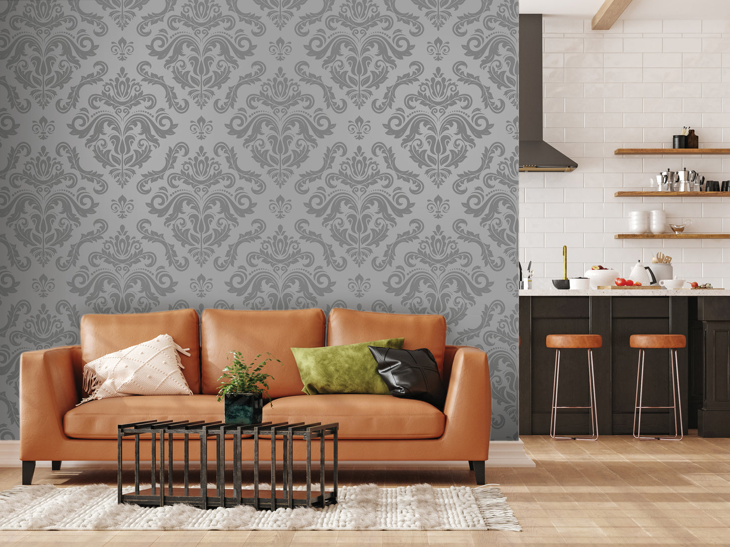 a modern living room with a large, ornate gray wallpapered wall, a brown leather sofa with decorative pillows, a black metal coffee table, and a kitchen counter with stools in the background.