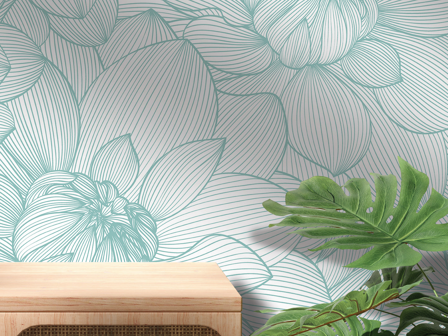 a wallpapered wall with a wooden table in the foreground, and a plant with large leaves in the background.