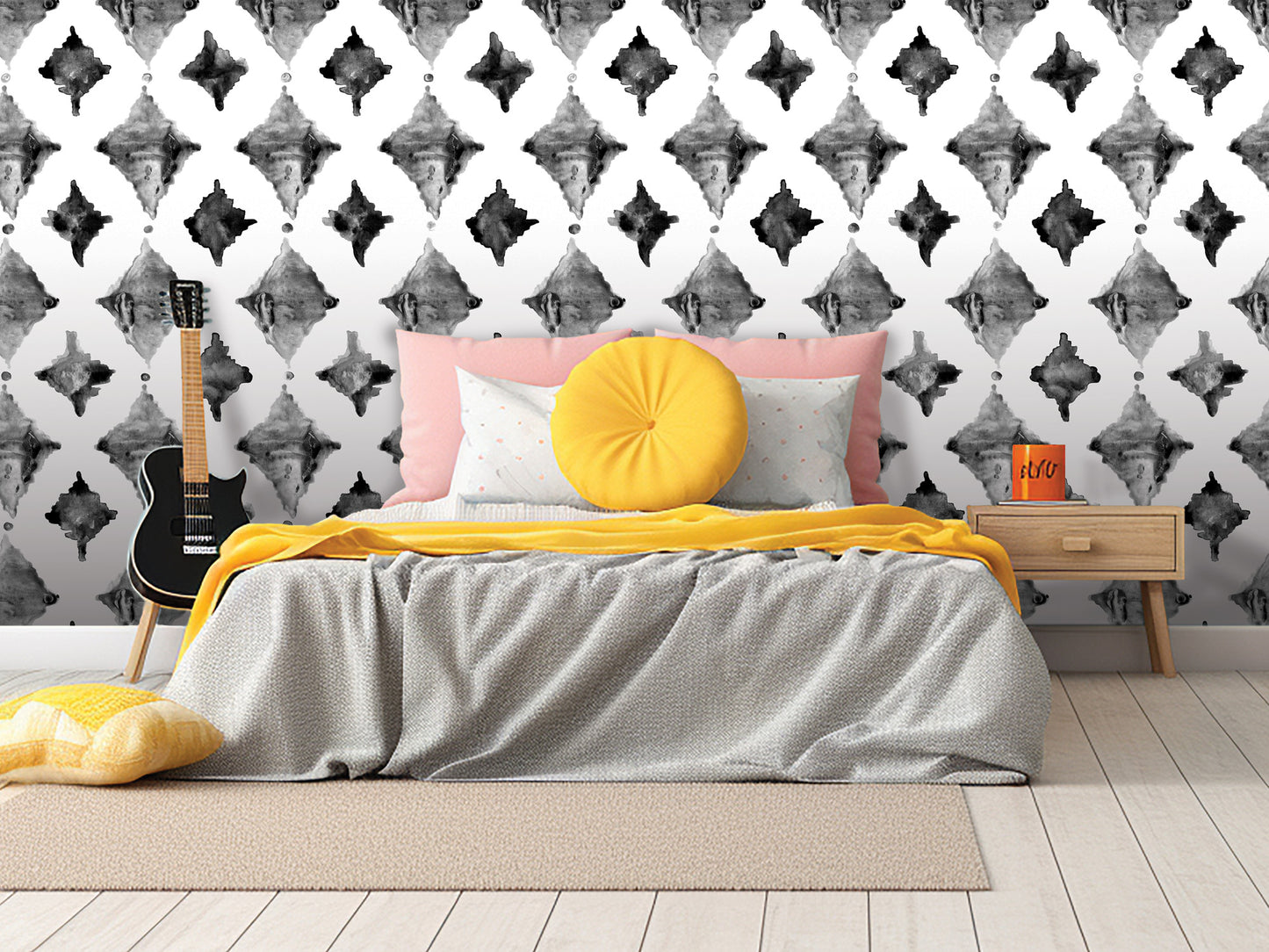 a modern bedroom with a black and white geometric patterned wallpaper, a gray bed with a yellow throw pillow, a wooden nightstand, and a guitar leaning against the wall.