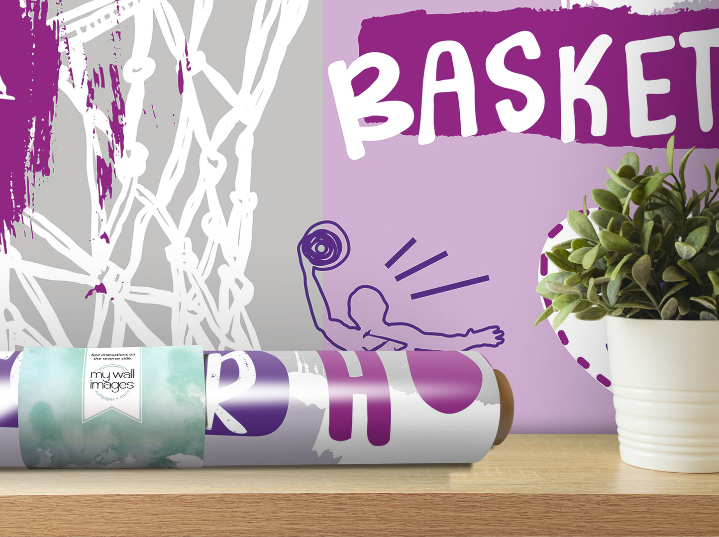 a basketball-themed wall decal, a potted plant, and a roll of wallpaper with a basketball design.