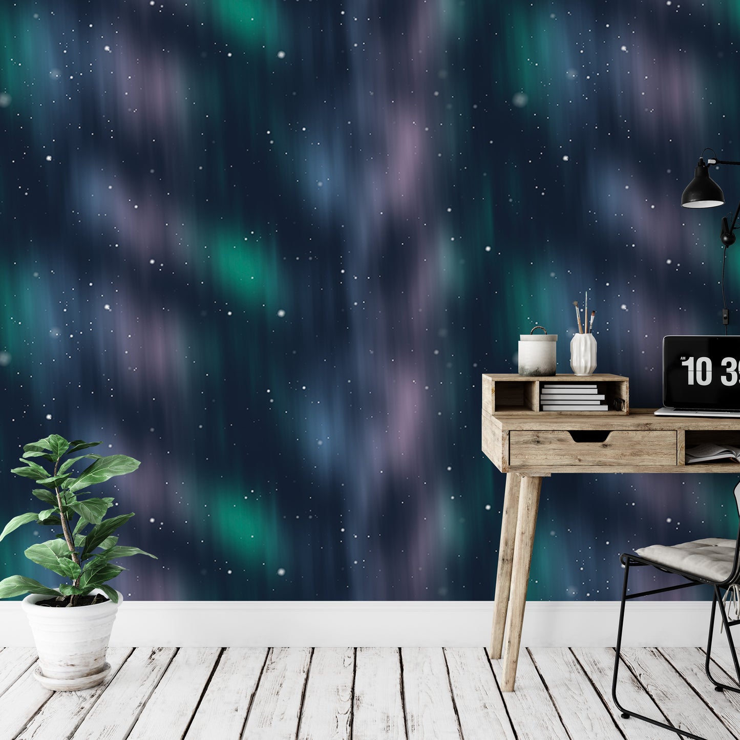 a workspace with a wooden desk, a laptop, and a potted plant, set against a wall with a vibrant, starry night sky wallpaper.
