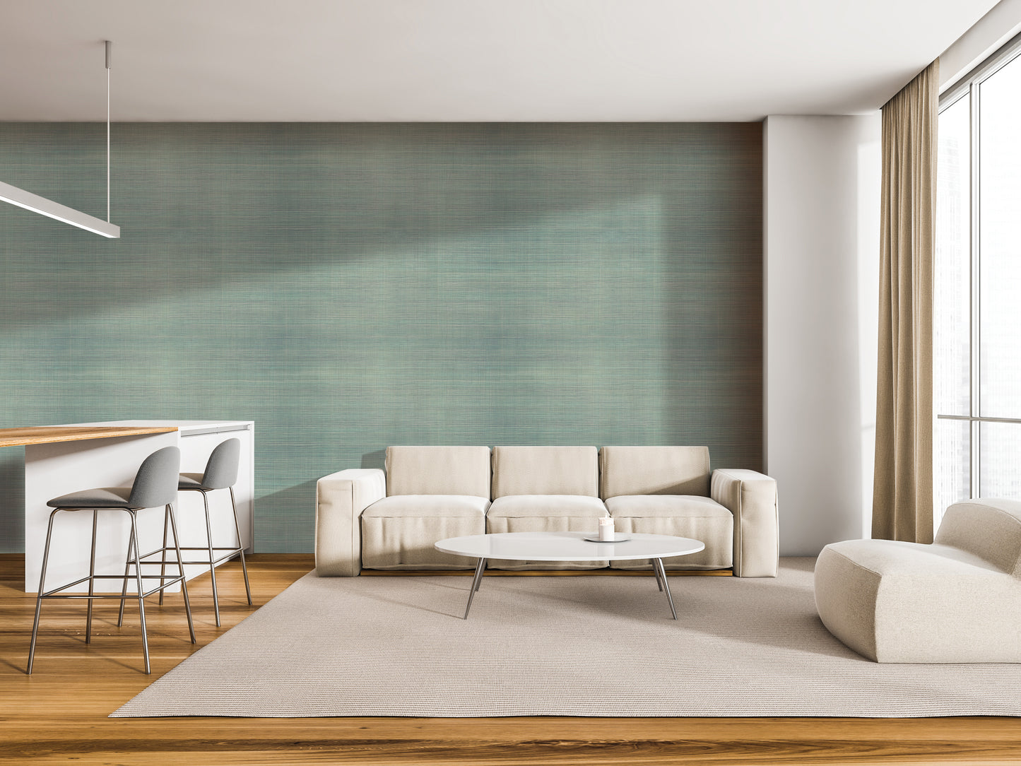 a modern living room with a white sofa, a round coffee table, and a barstool. The room has a neutral color scheme with a green accent wall and a wooden floor.