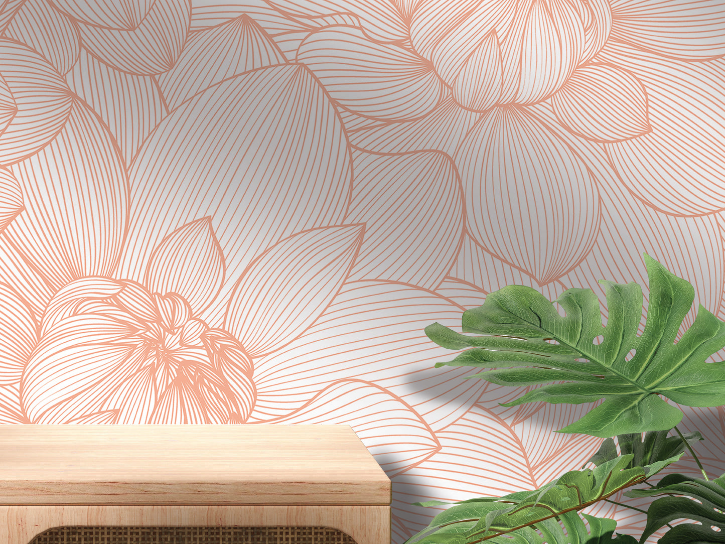 a wooden table with a plant on top of it, set against a wall with a floral pattern in shades of orange and white.