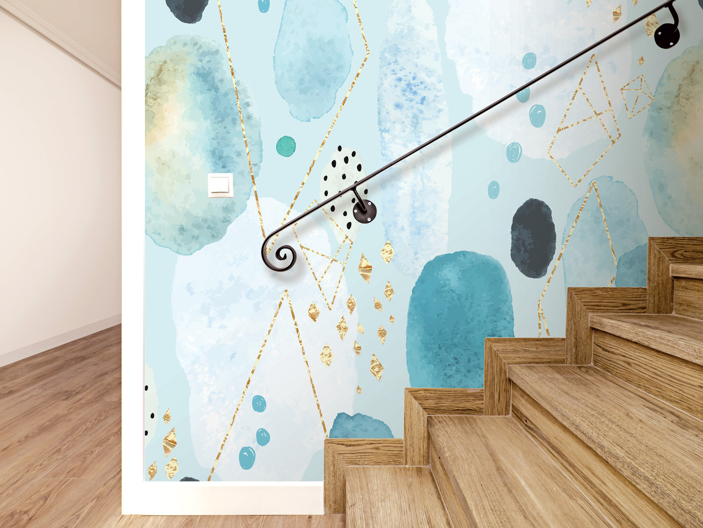 a wall with a blue abstract pattern and gold accents, along with a wooden staircase.