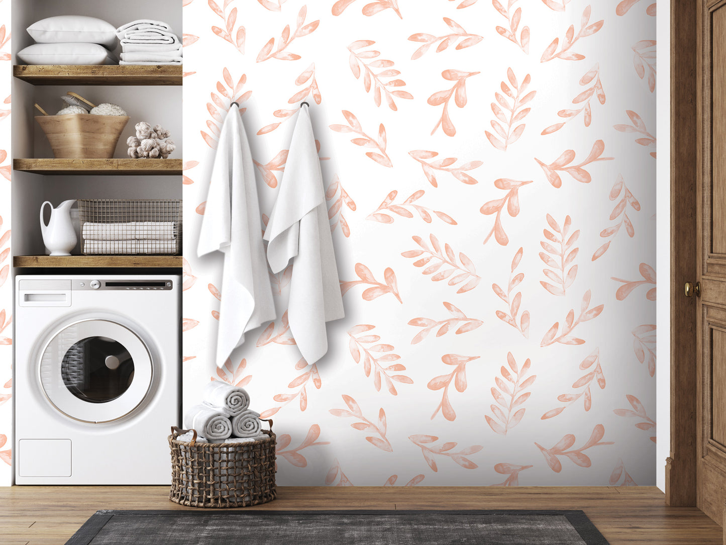 a bathroom with a white washing machine, a shelf with towels and baskets, and a wall with a patterned wallpaper featuring orange leaves.