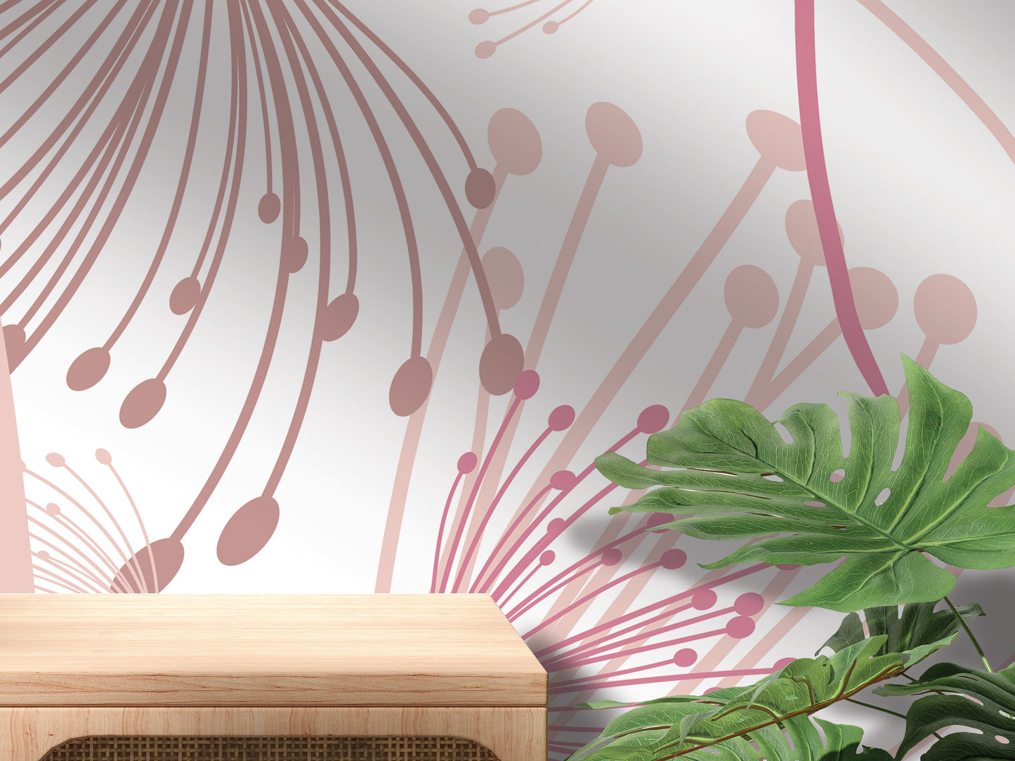 a wall with a floral pattern and a wooden table in the foreground.