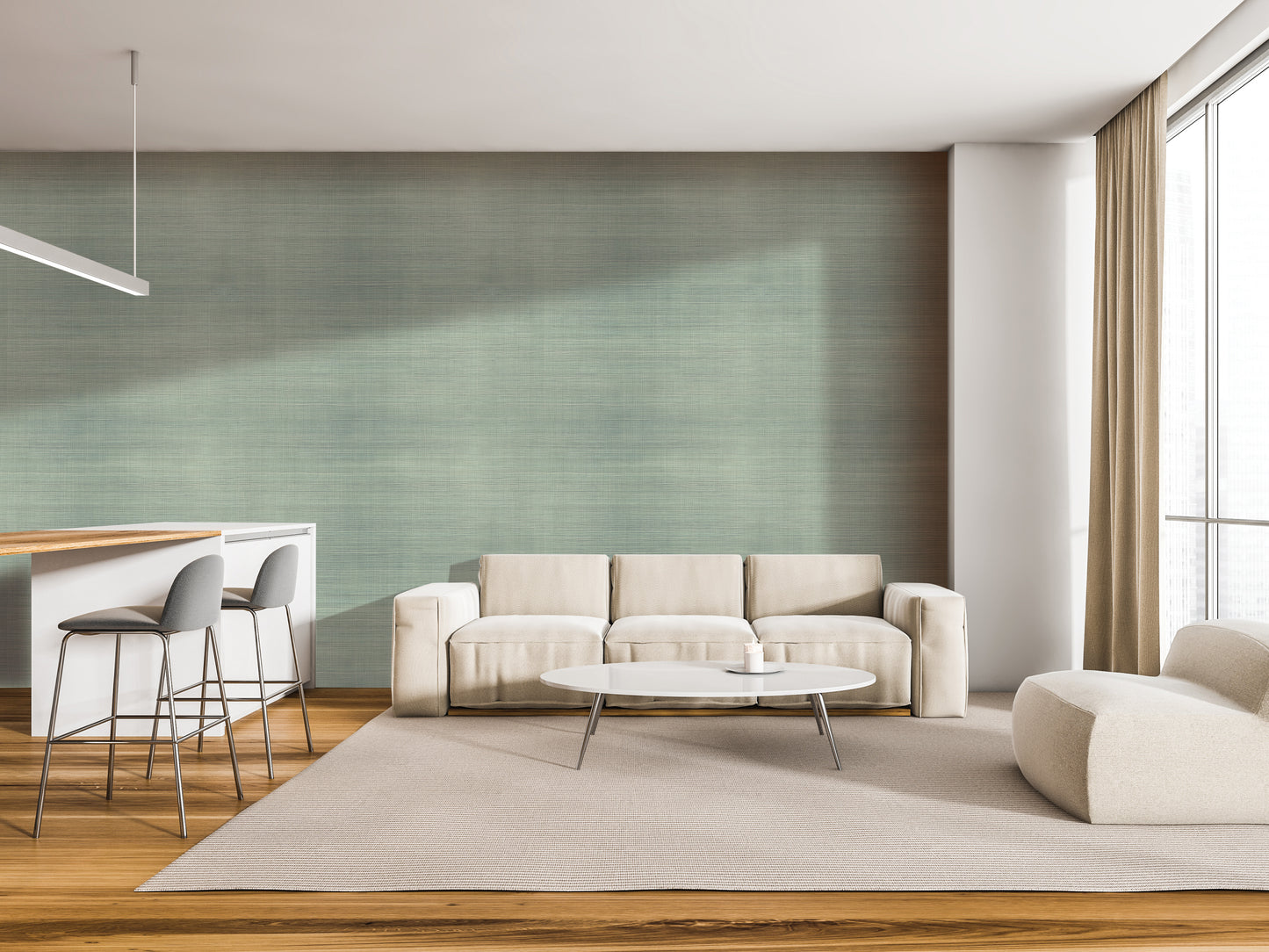 a modern living room with a white sofa, a round coffee table, and a barstool. The room has a neutral color scheme with a green accent wall and a wooden floor.