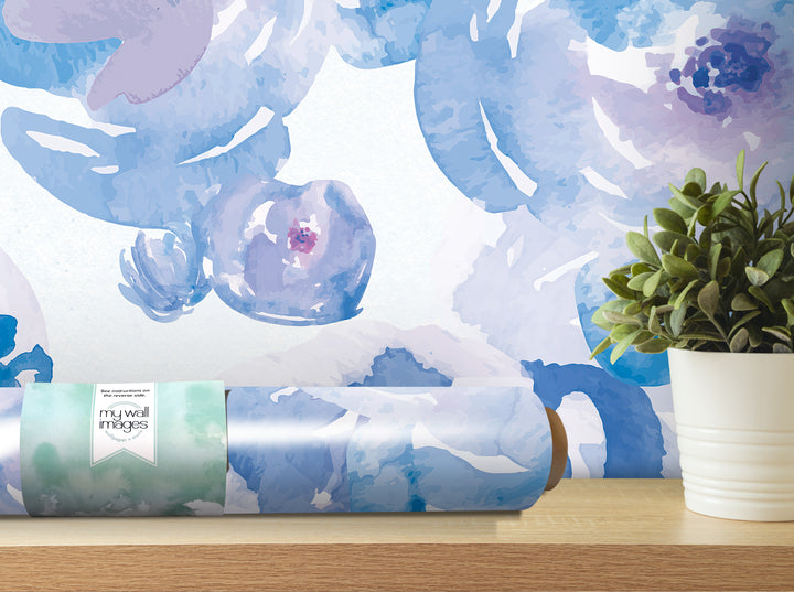a wallpapered wall with a potted plant on a shelf, and a roll of wallpaper with a floral pattern on a table.