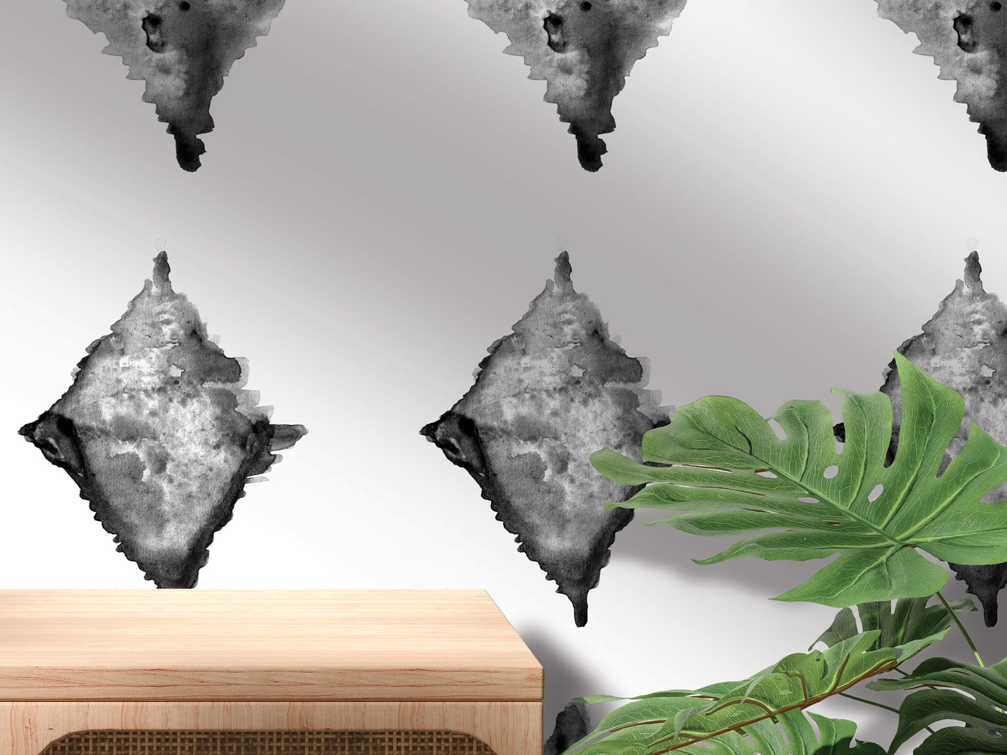 a wooden table with a plant on top of it, set against a wall with a repeating pattern of black and white diamond-shaped designs.