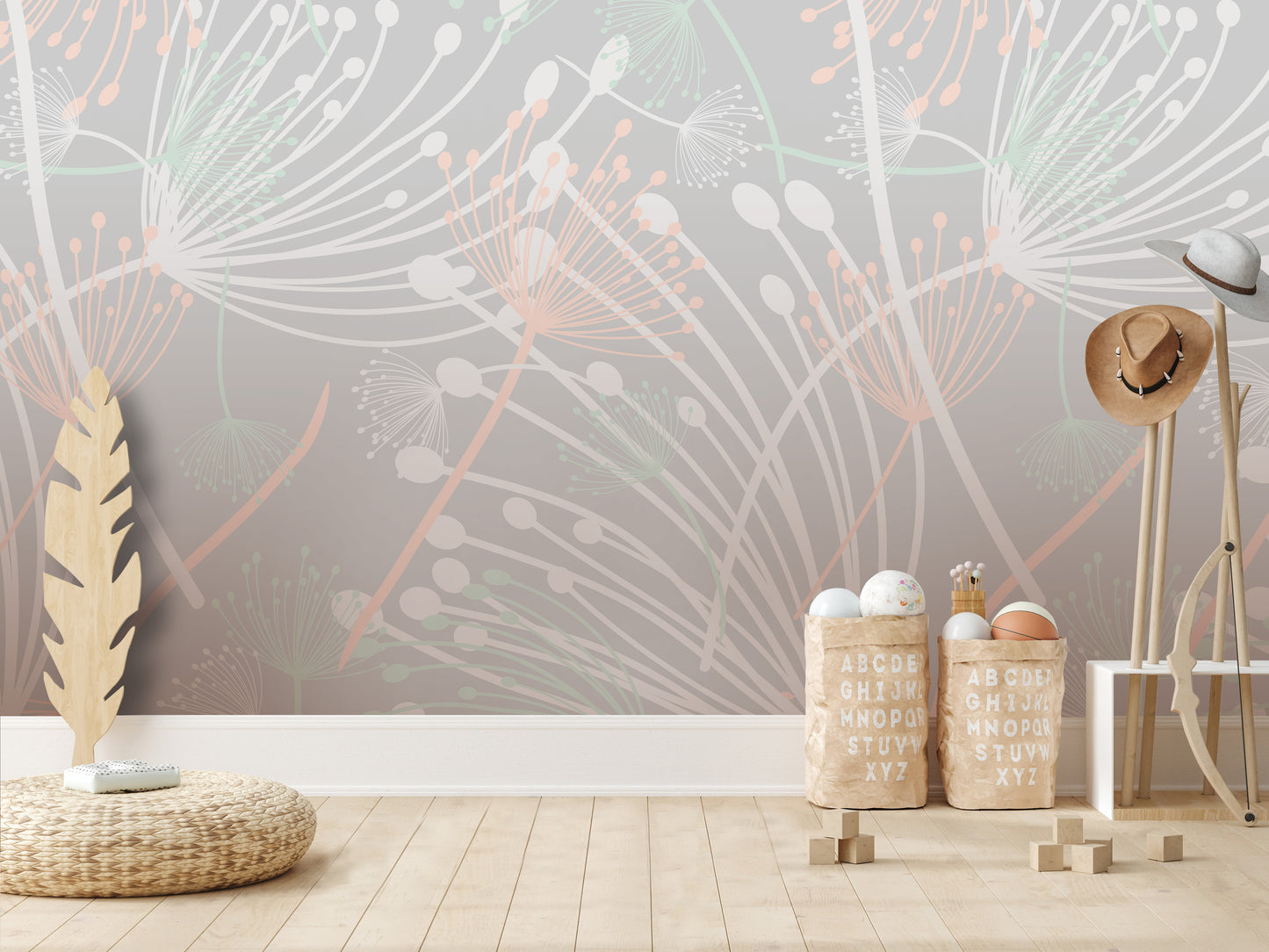 a room with a large wallpapered wall, a wooden floor, and various objects such as baskets, a hat rack, and a feather.