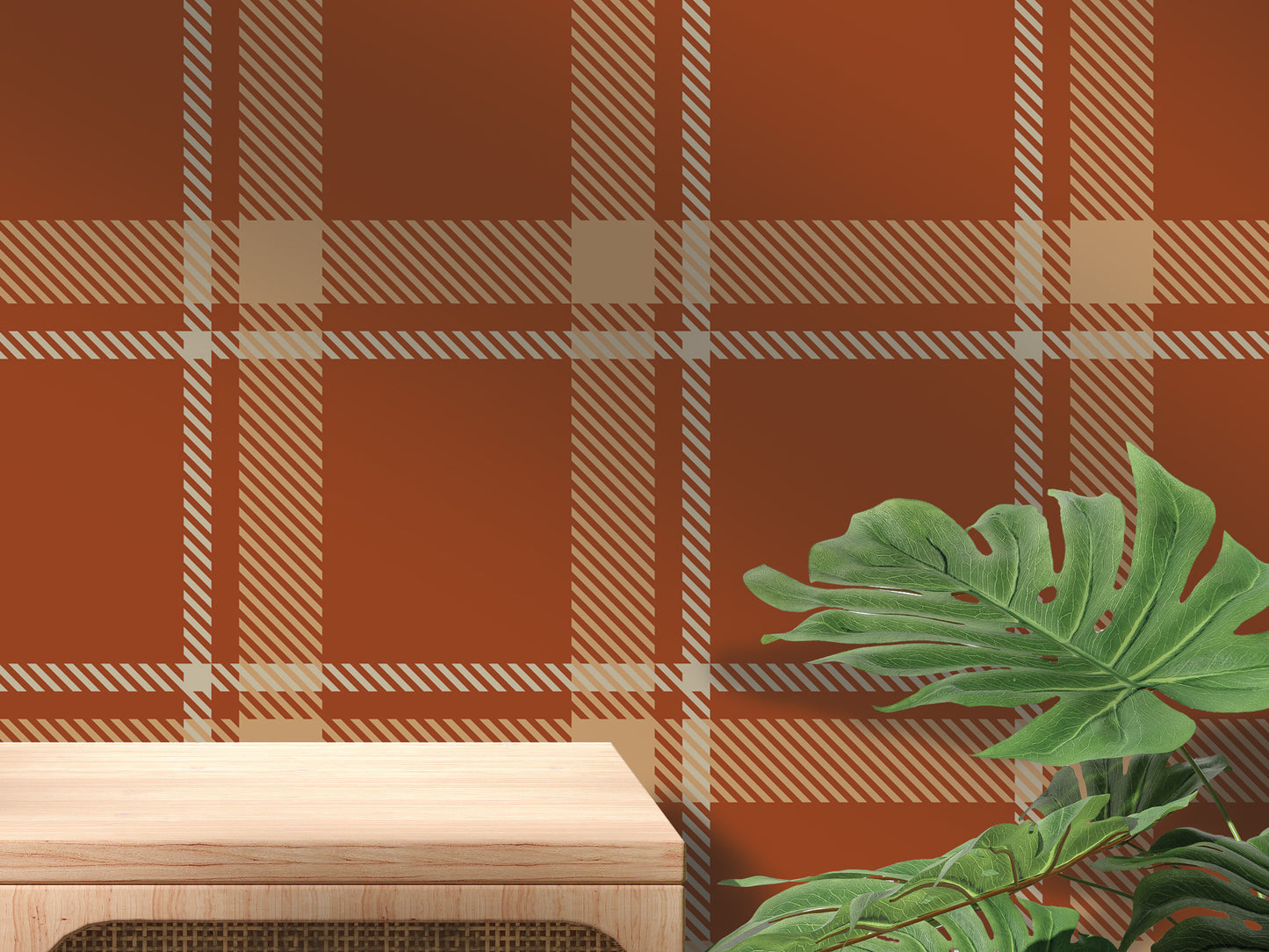 a wooden table with a plant on top of it, set against a wall with a red and white plaid pattern.