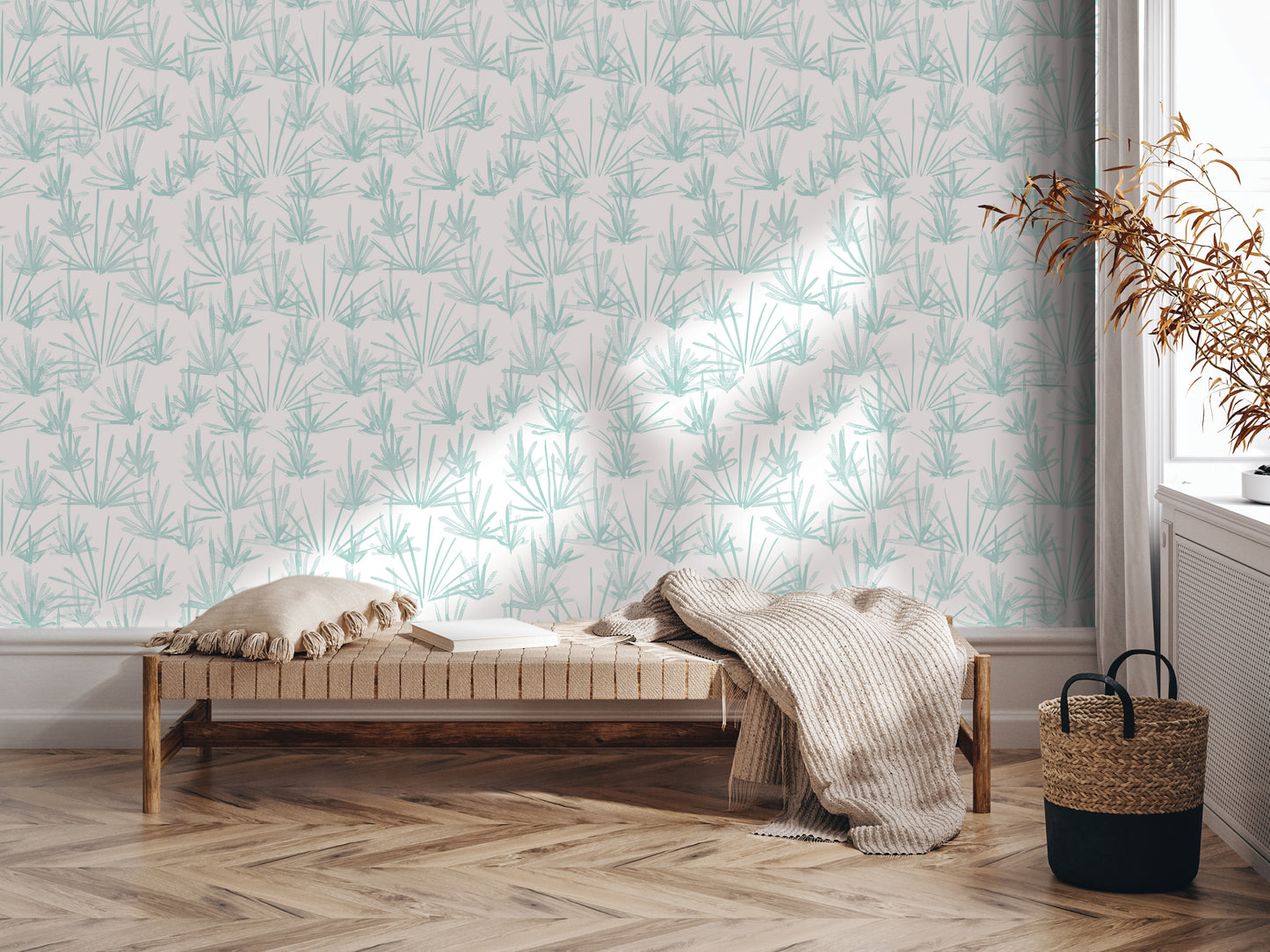 a cozy living room with a wooden bench, a woven basket, and a potted plant. The room has a patterned wallpaper with a repeating design of green and white plants, creating a calming and natural atmosphere.