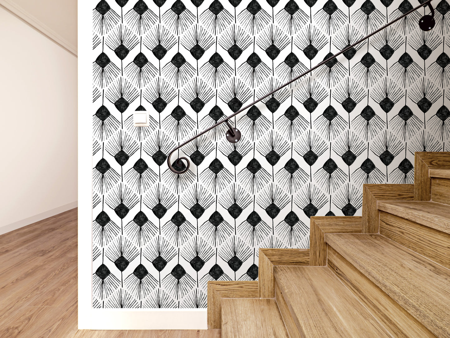 a staircase with wooden steps and a black and white geometric patterned wall behind it.