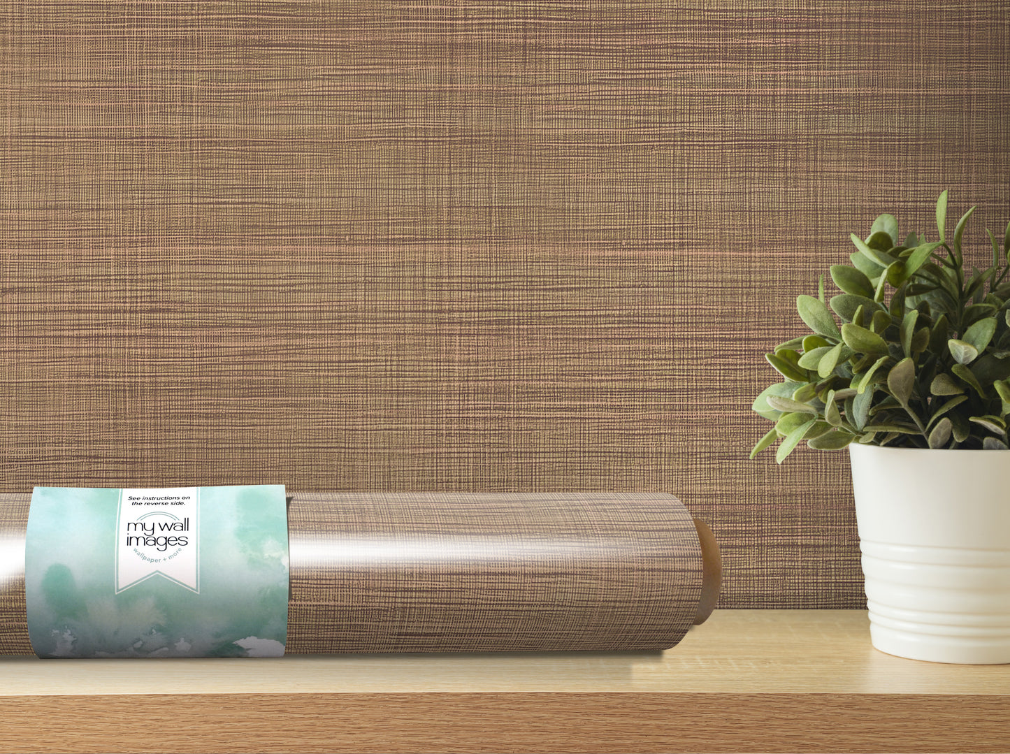 a wooden shelf with a potted plant and a roll of wallpaper on it.