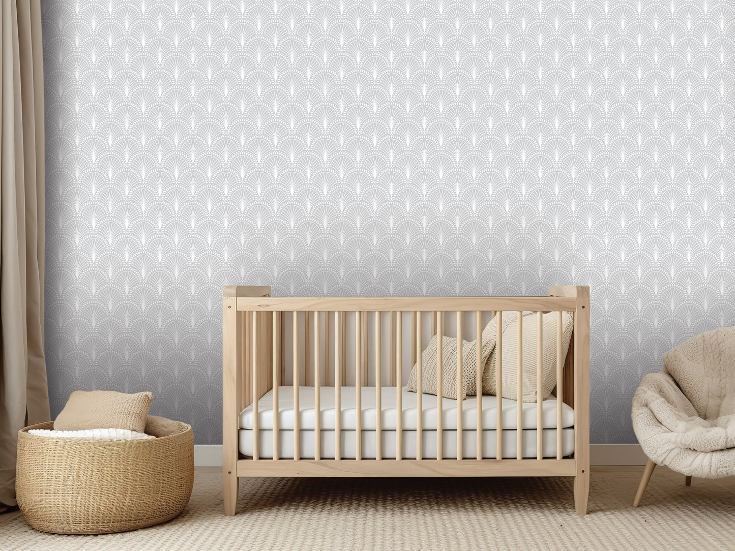 a serene nursery room with a wooden crib, a beige chair, and a woven basket. The crib is positioned in front of a gray wall with a repeating pattern of white circles.