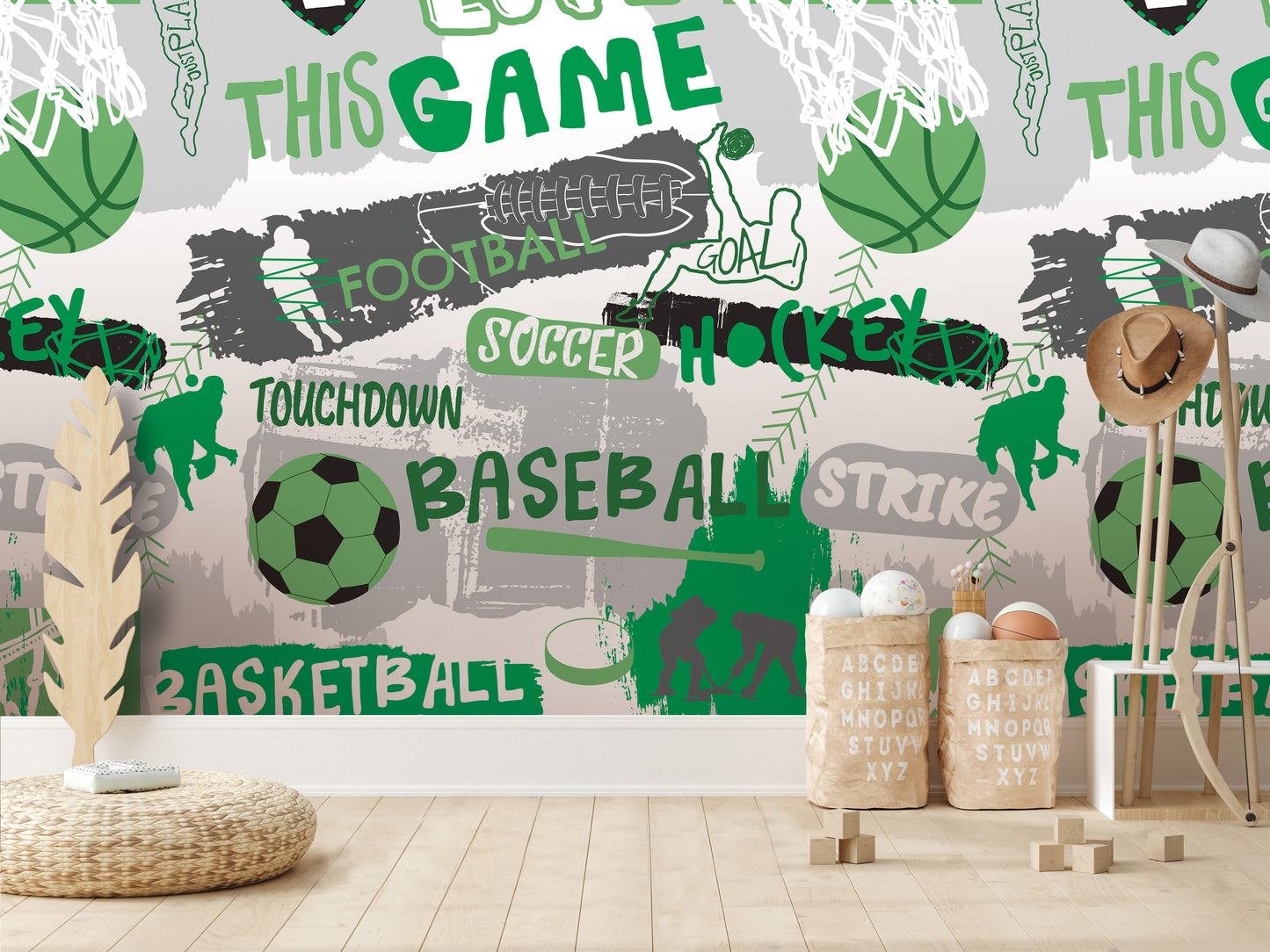 a wall with a collage of various sports-related images, including a basketball, soccer ball, and baseball, along with the words "TOUCHDOWN", "SOCcer", "HOCKEY", "BASEBALL", and "STRIKE". There are also some baskets and a hat in the foreground.