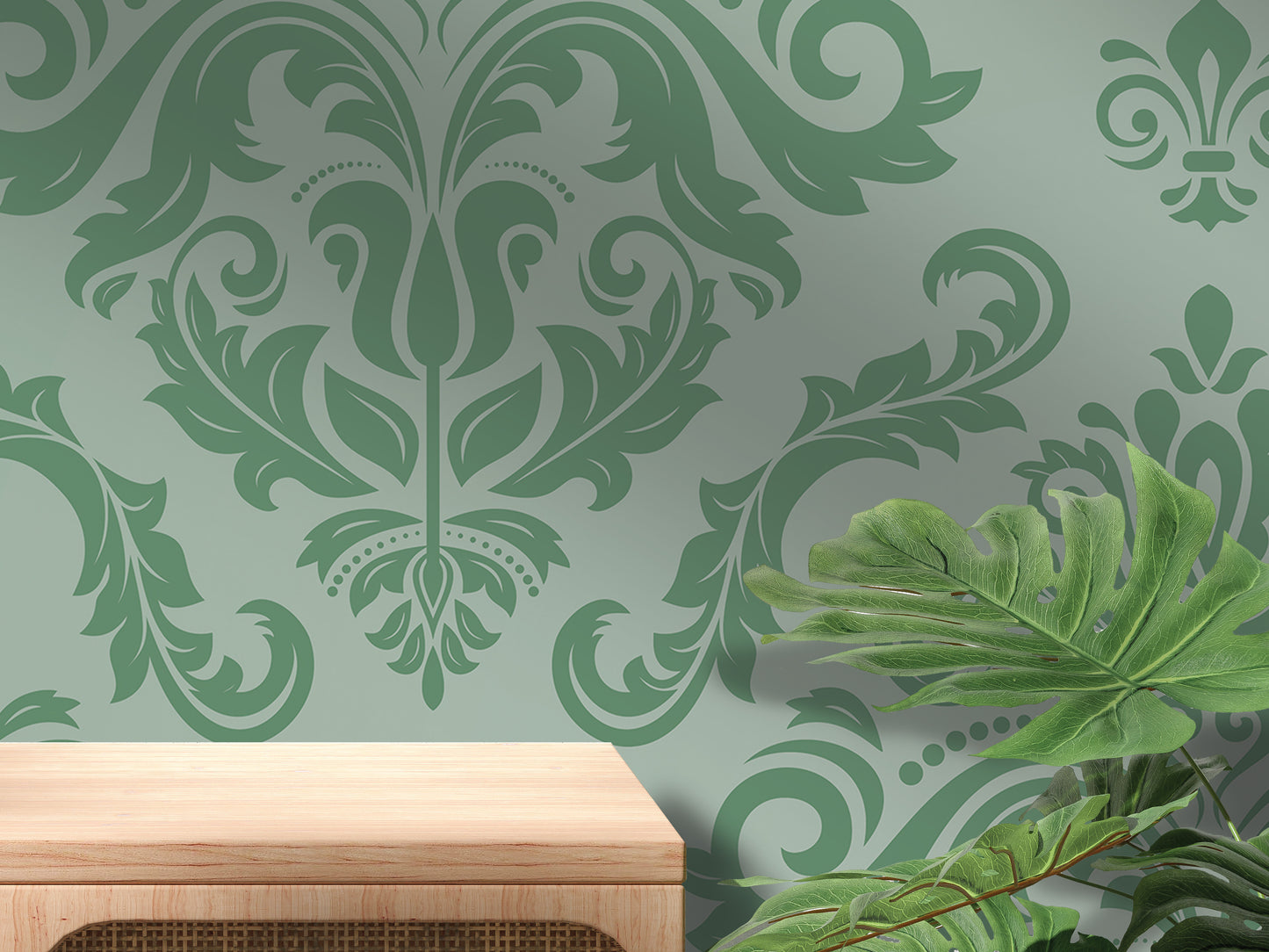 a wall with a green floral pattern and a wooden table in the foreground.