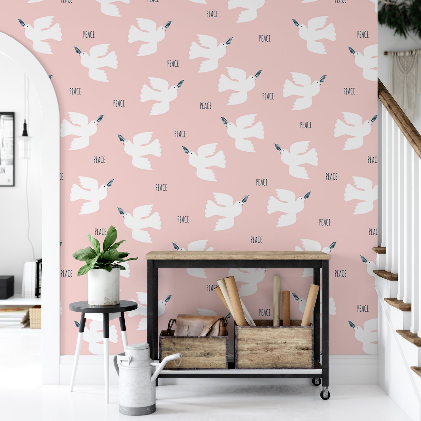 a pink wall with a repeating pattern of white doves and the word "PEACE" written below them. In front of the wall, there is a small table with a plant on it, and a wooden crate holding various items.